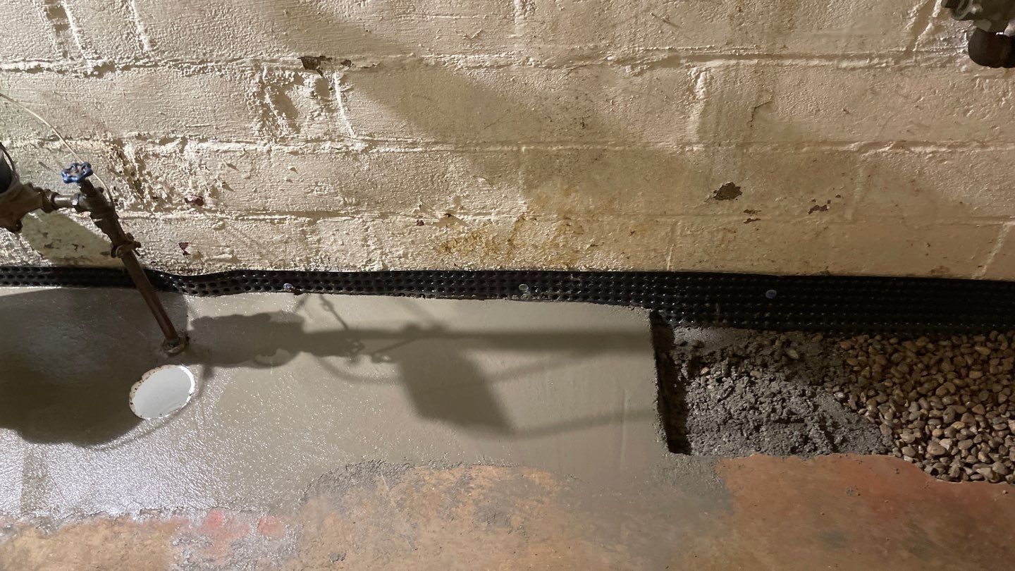Interior Drain Tile & Sump Pump System in North Minneapolis by Waterproofing Northeast