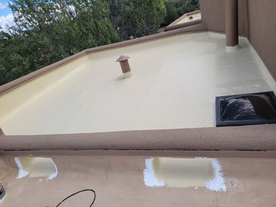Residential Roofing Installation using Tropical Silicone Coating Reflective Tan