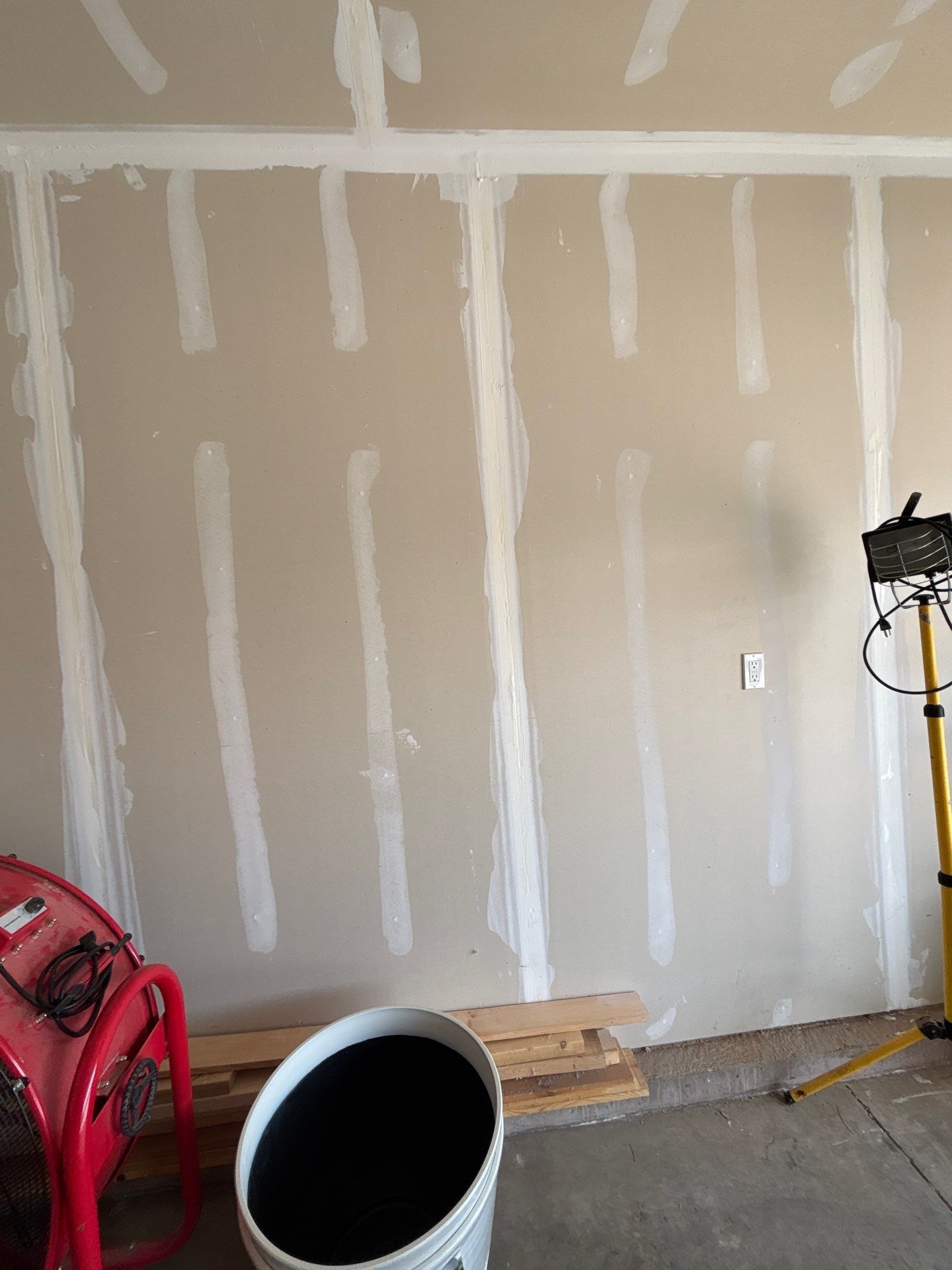 Grey Flake Epoxy Garage Floor Coating in Sioux Falls by Select Painting, Coatings & Garage Cabinets
