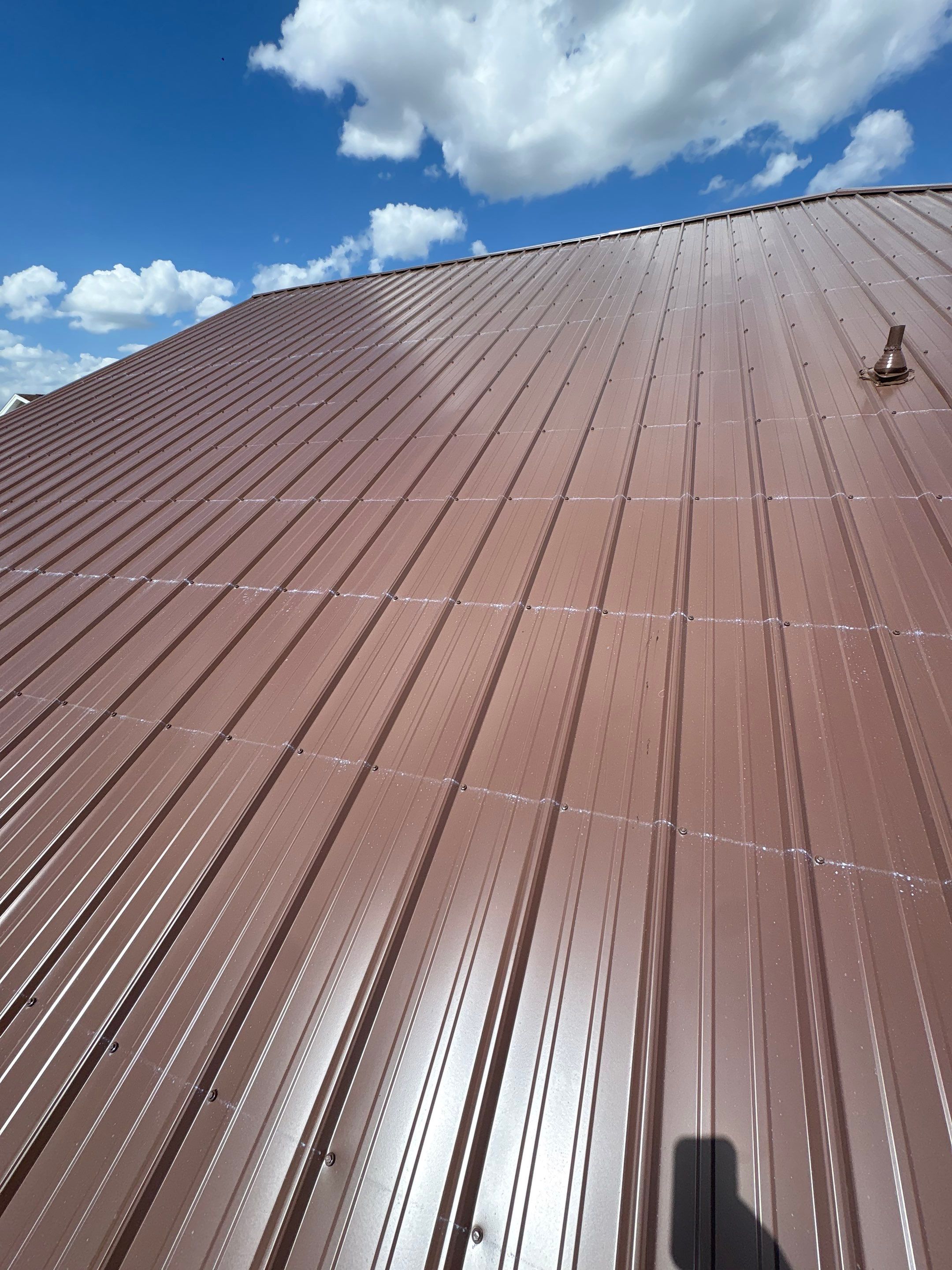 Residential Metal Roofing Installation and Gutter Replacement in Kissimmee by Pinnacle Roofing Group