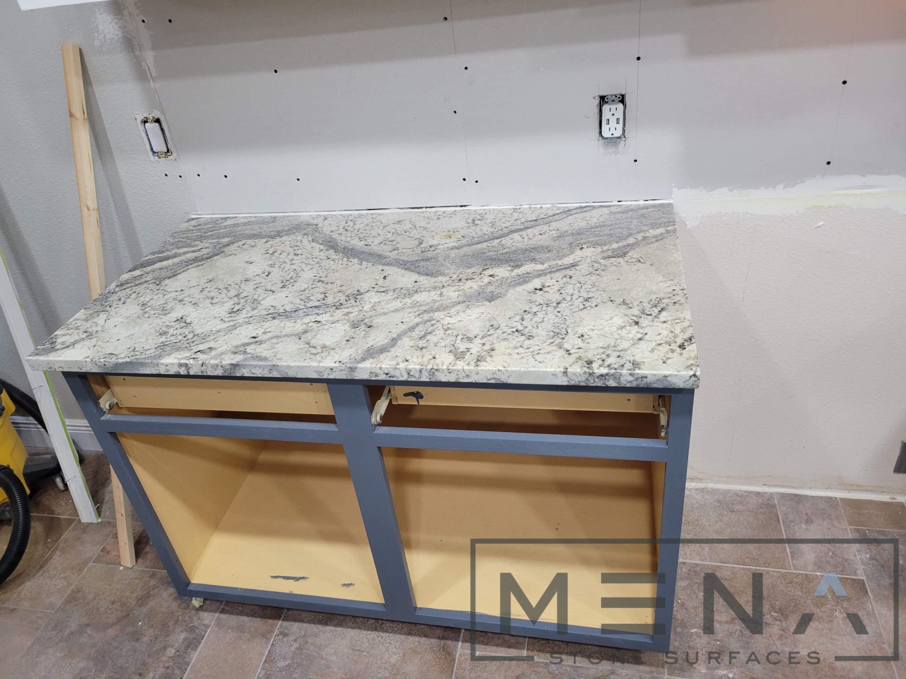 Kitchen countertops using Alaska Blue Granite by Mena stone surfaces