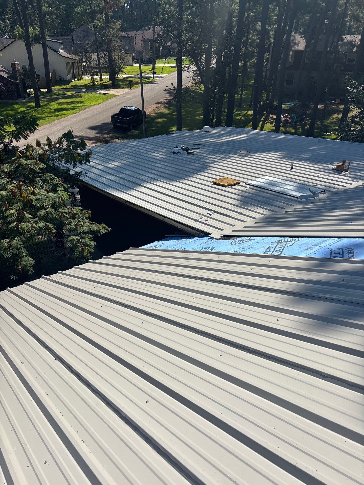 White Standing Seam Metal Roof Replacement in Willis, Texas by Abbott Roofing Company