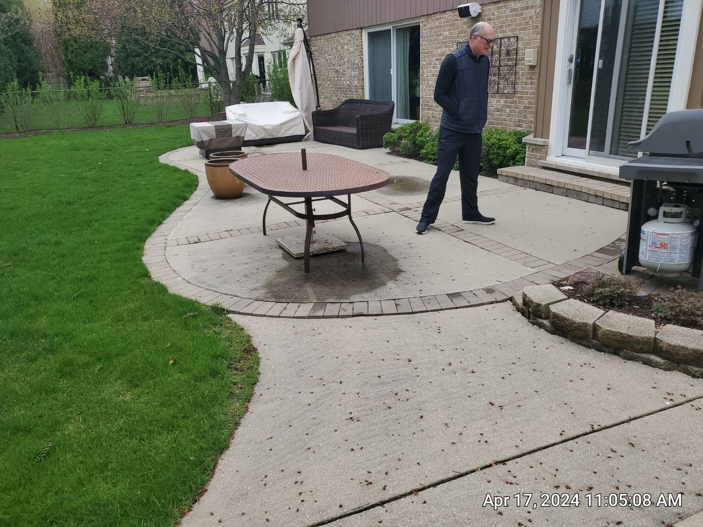 concrete patio and driveway cleaning by Northern Power Washing LLC.