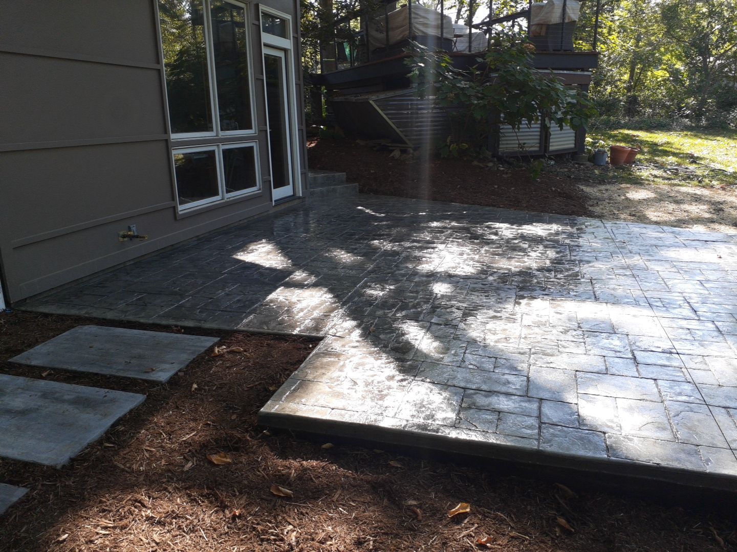 Back Yard Cantilivered Patio by LAND ESCAPES LLC