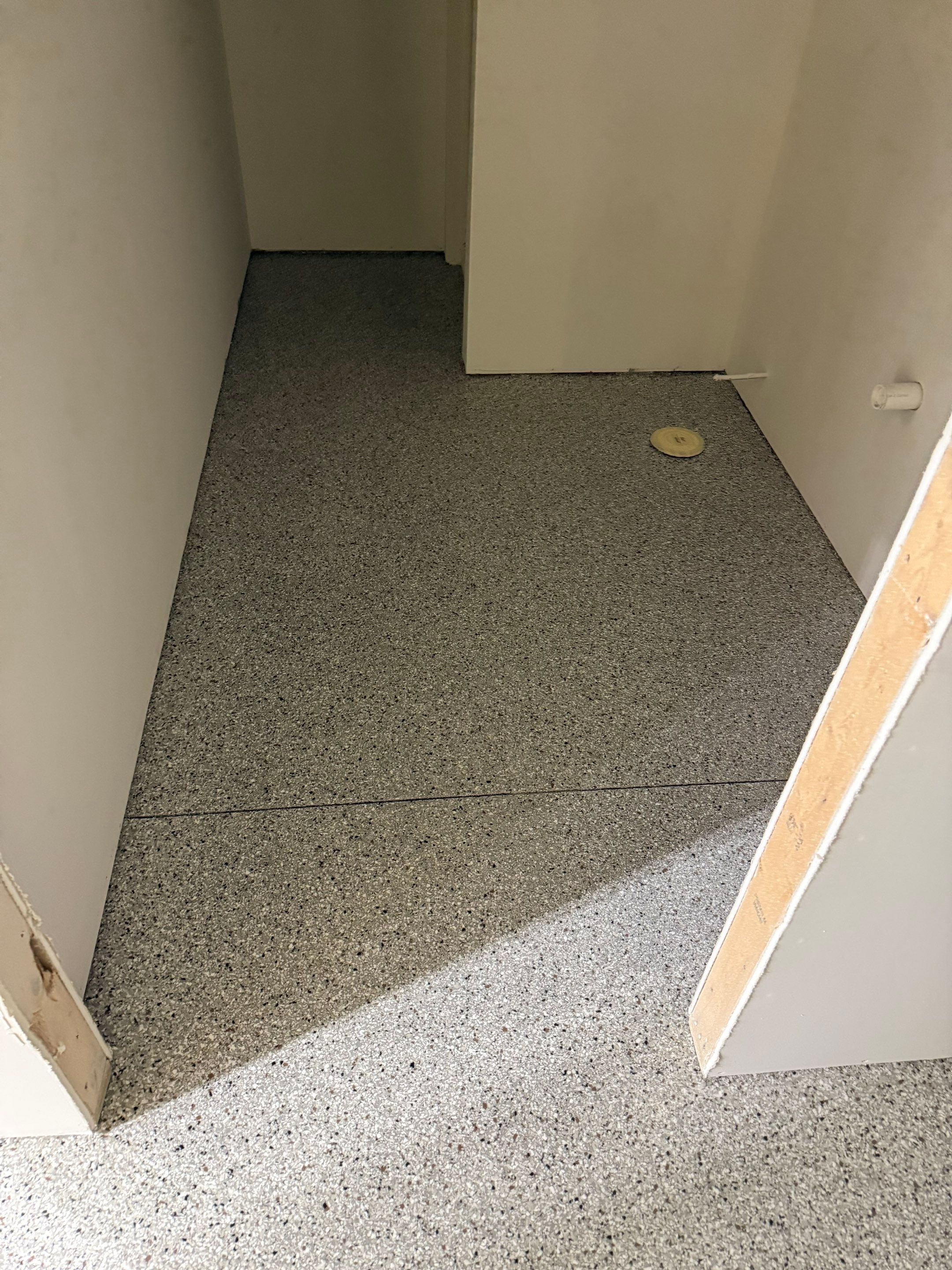 Custom Speckled Floor Coating for Large Montrose Shop by Select Painting, Coatings & Garage Cabinets