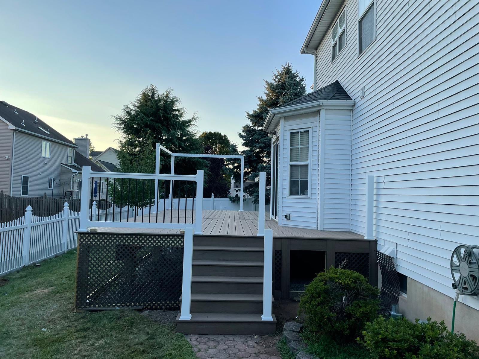 New Deck with Pergola and Vinyl Lattice by deck guardian