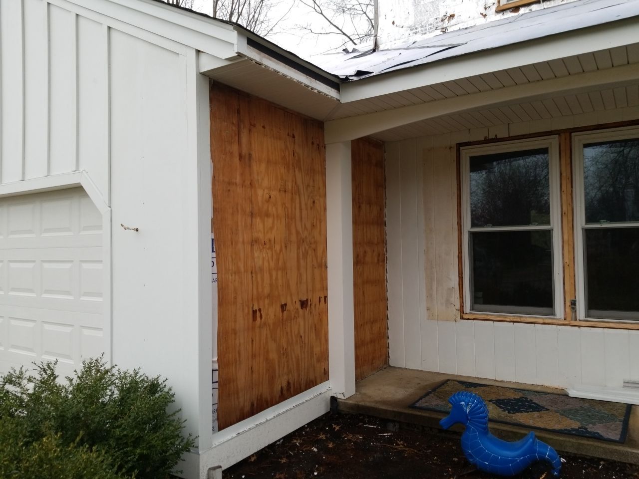 James Hardie Siding  using James Hardie Board and Batten, White by Absolute Roofing and Construction