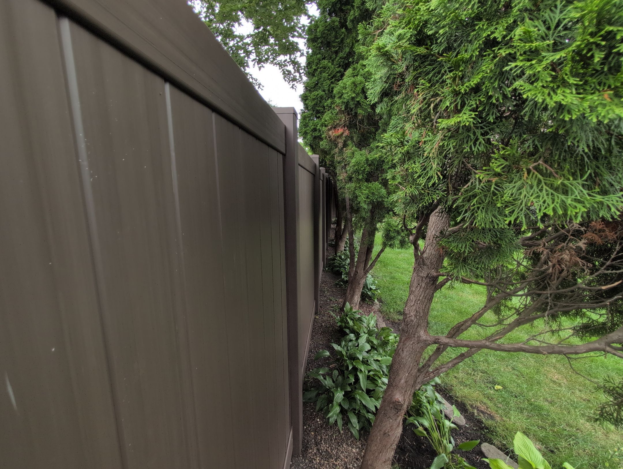 Walnut Vinyl Privacy Fence Installation in Waterloo by Perfect Picket Fence and Stain