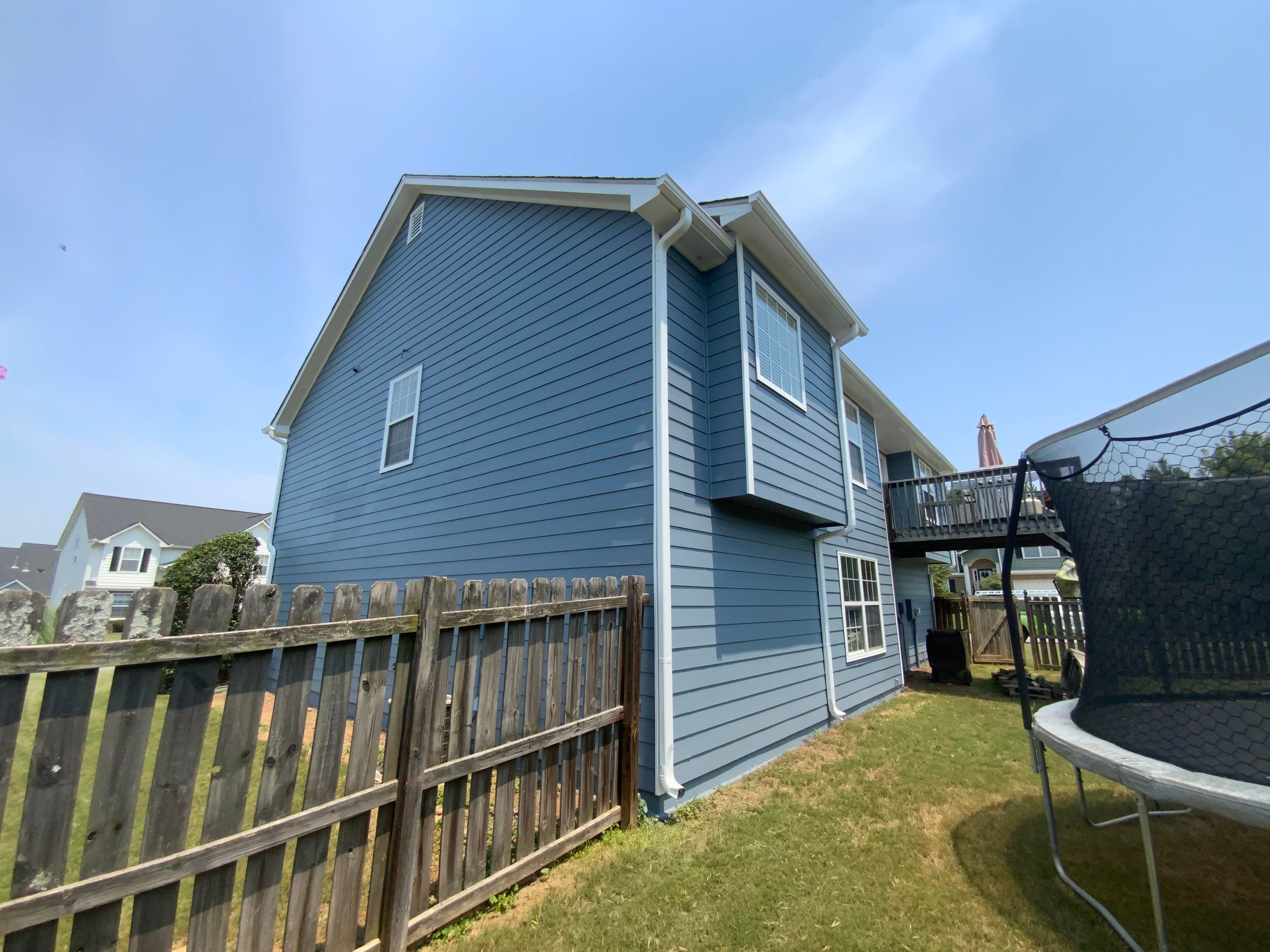 Comprehensive Exterior Painting for Cartersville Home with Blue Siding Transformation by Swift Home Renovations