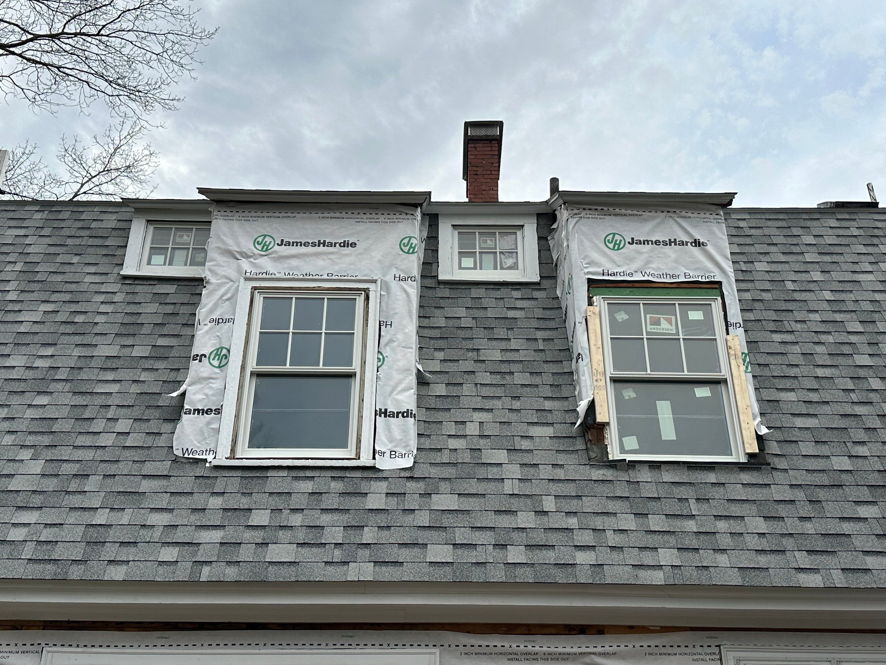 White cedar shingles and windows in Wayland, MA by UBrothers Construction