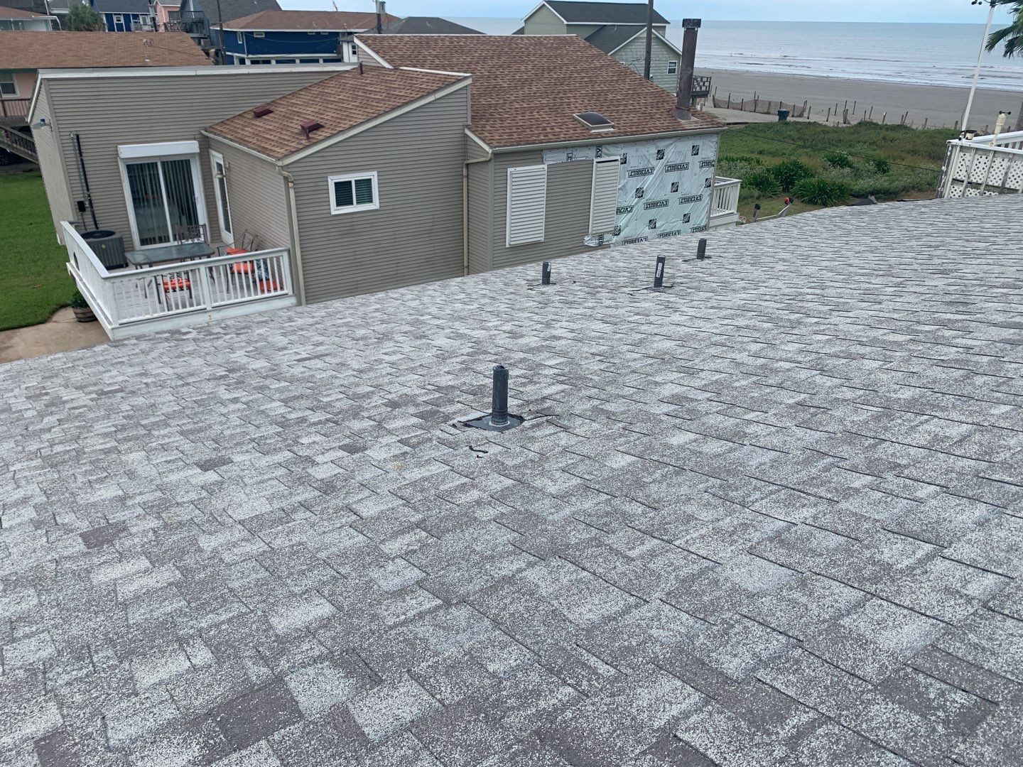 Galveston Waterfront Roof Installation In Progress by Elite Roofing LLC