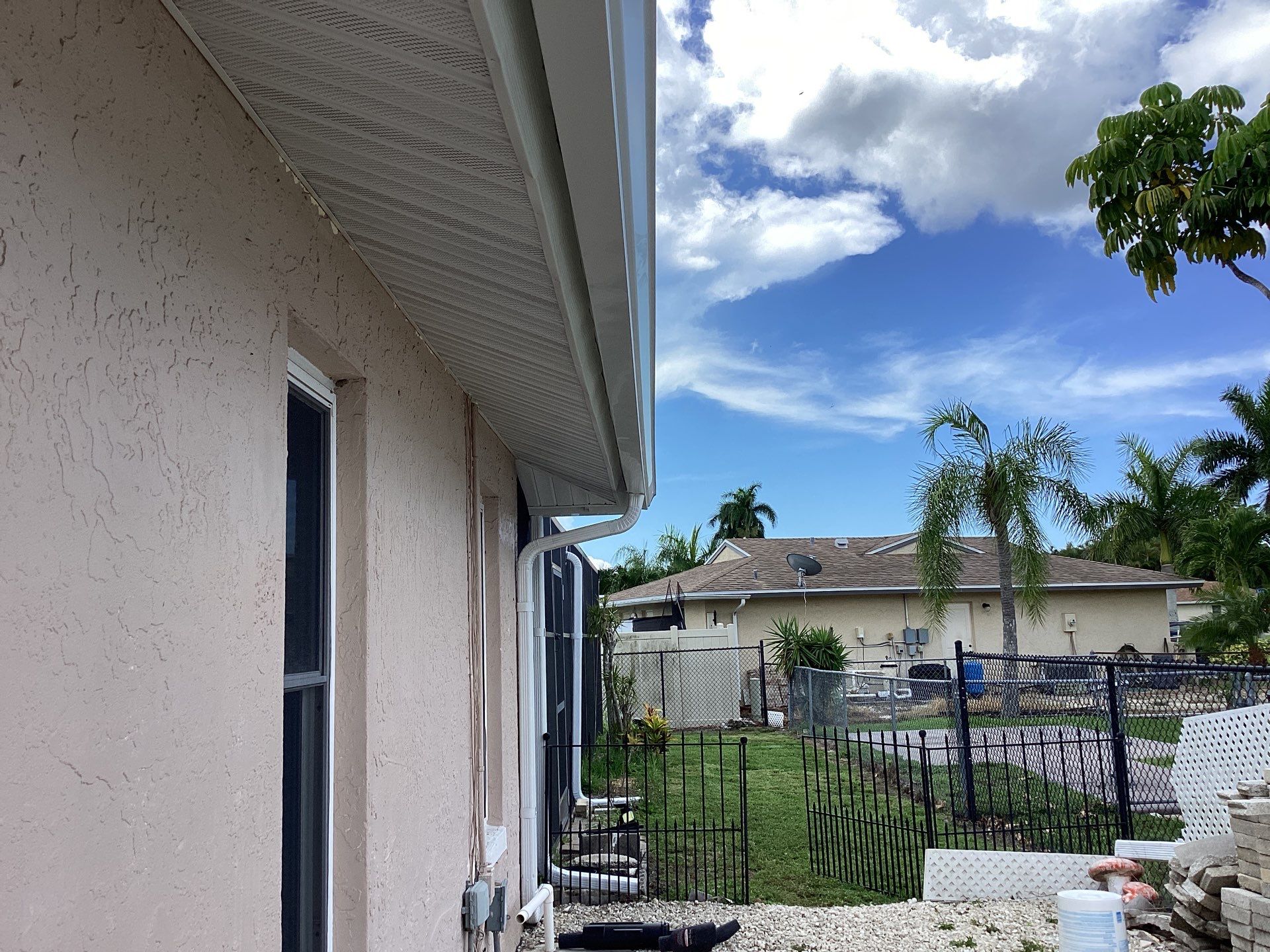 White Seamless Gutters and Splash Guards in Fort Myers FL by Gutter Professor by Gutter Professors