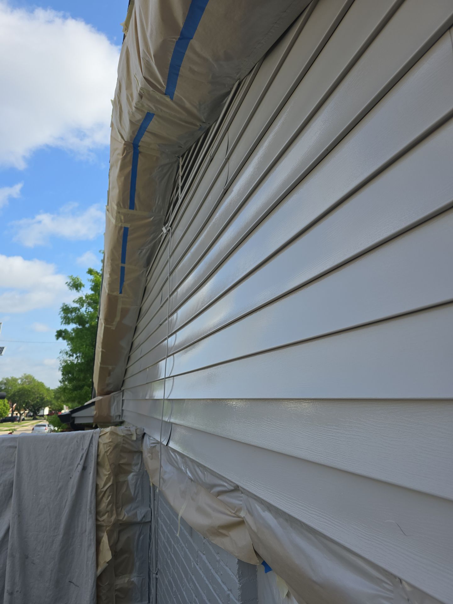 Exterior Home Paint Project with Different Surfaces by SLM General Contractors & Roofing