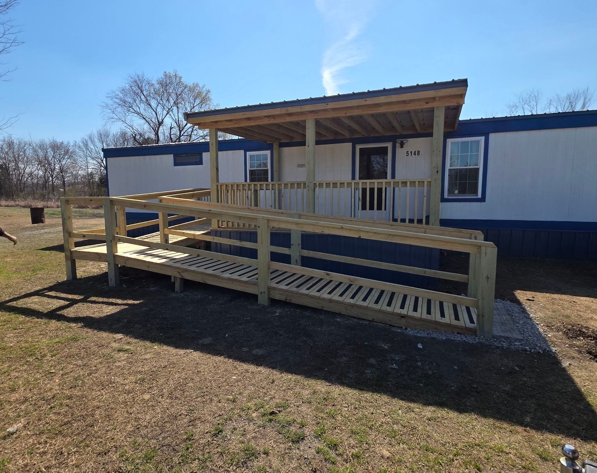 Covered Deck w/ ADA Ramp by In & Out Construction & Remodeling, LLC