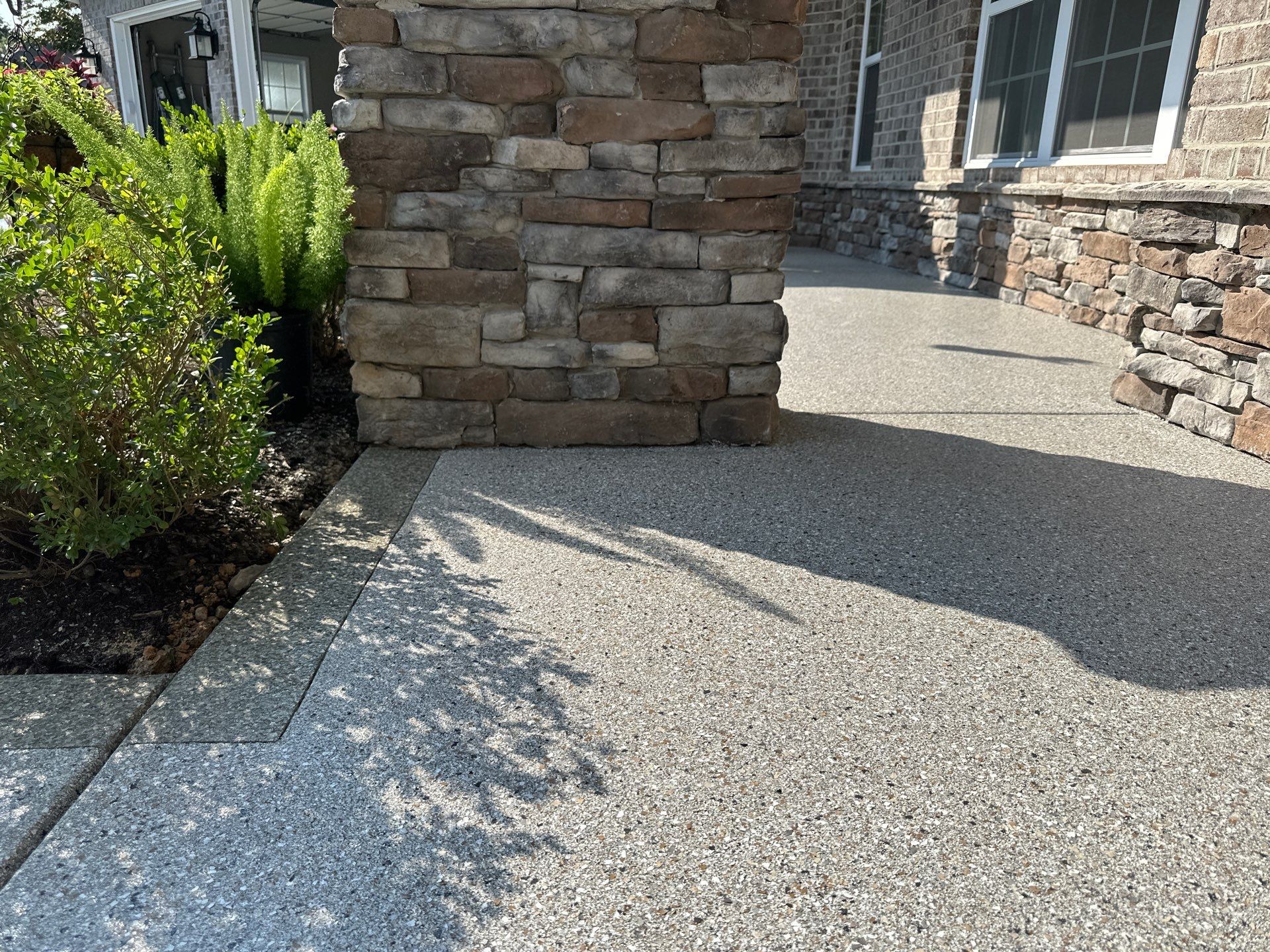 Driveway Improvement Using Claystone With Trail Mix Border! by Elite Floor Solutions