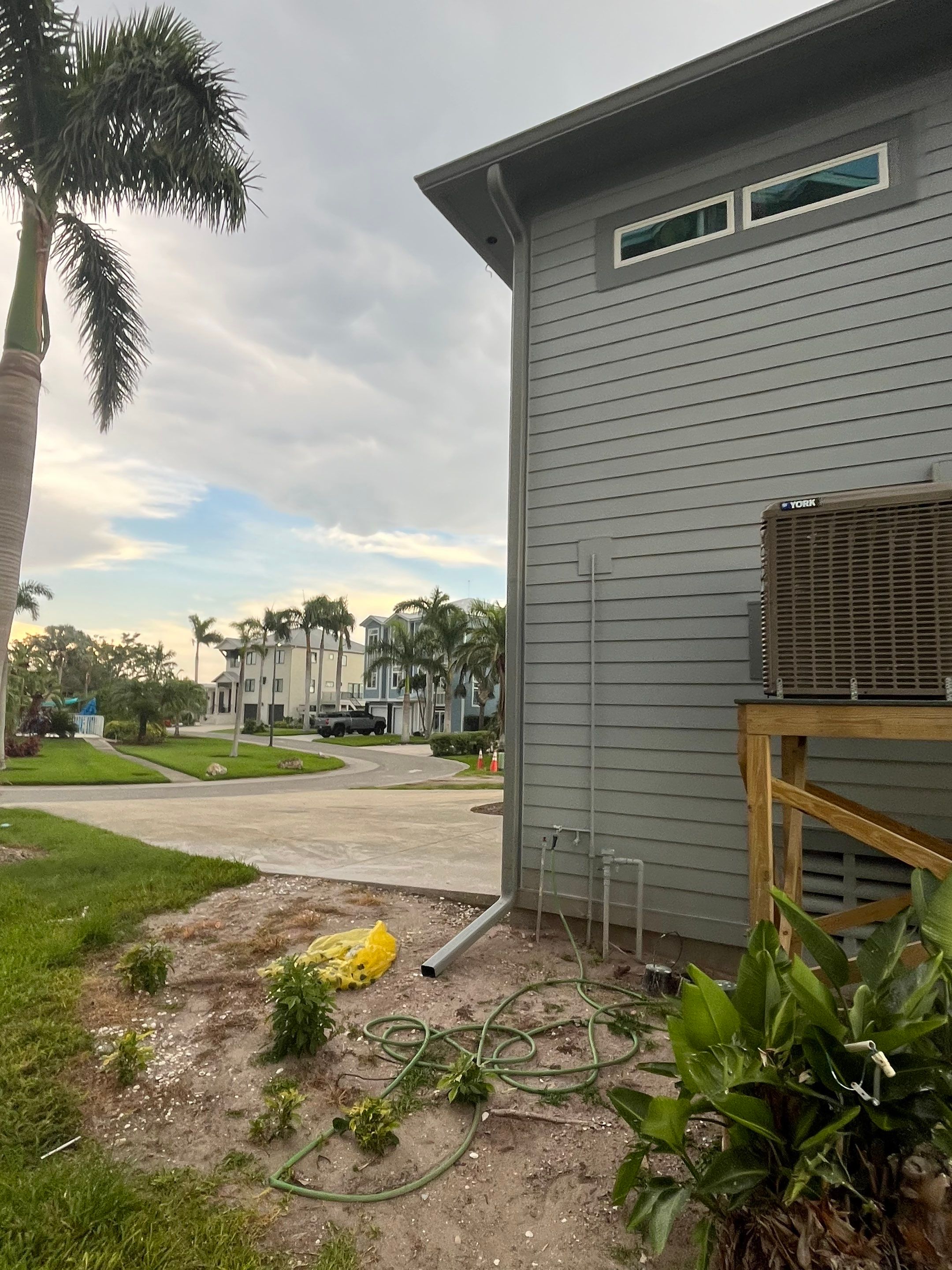 Downspout Installation Dove Grey Palmetto FL by Gutter Professors