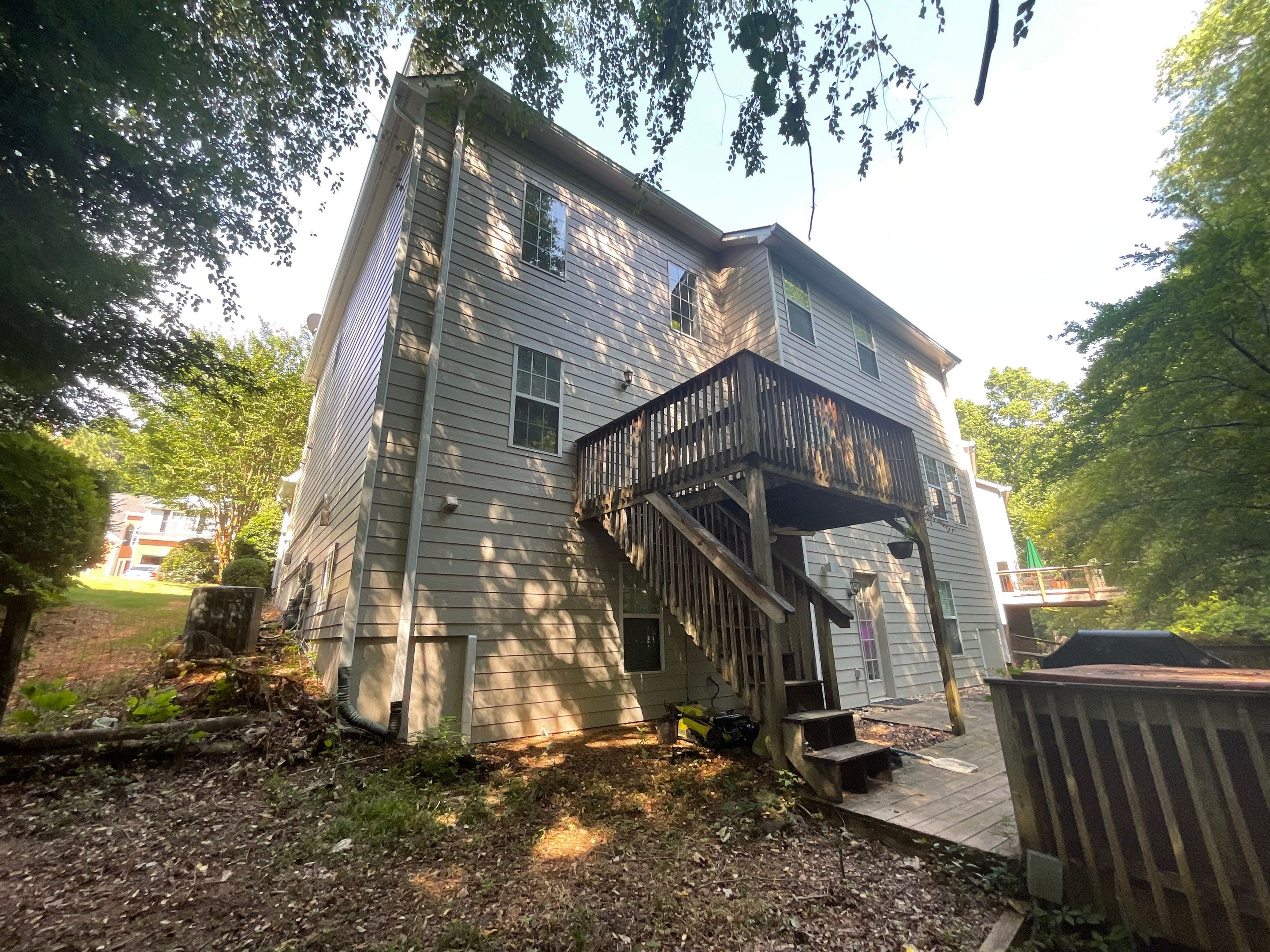 Stucco and Siding Exterior Painting with New Gutters in Kennesaw by Swift Home Renovations