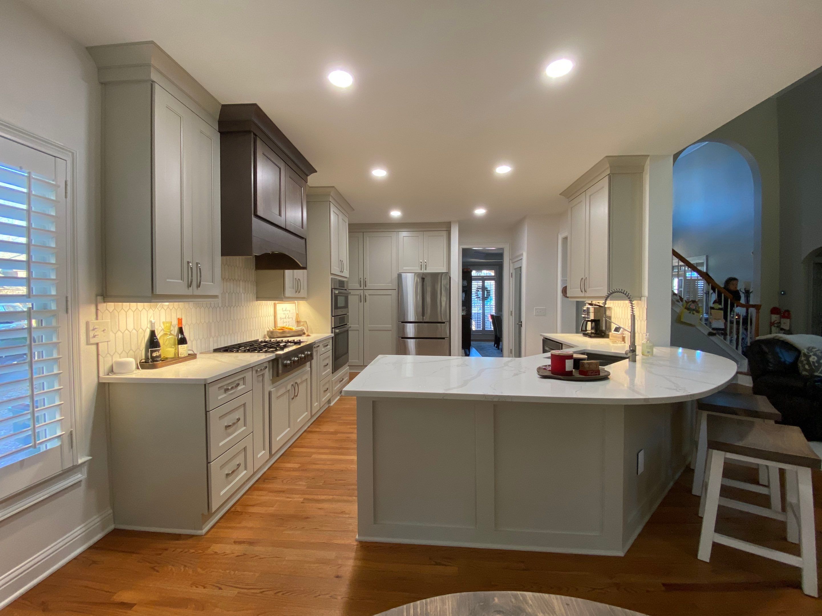 Modern Kitchen Remodeling with Quartz Island and Custom Vent Hood in Woodstock by Swift Home Renovations