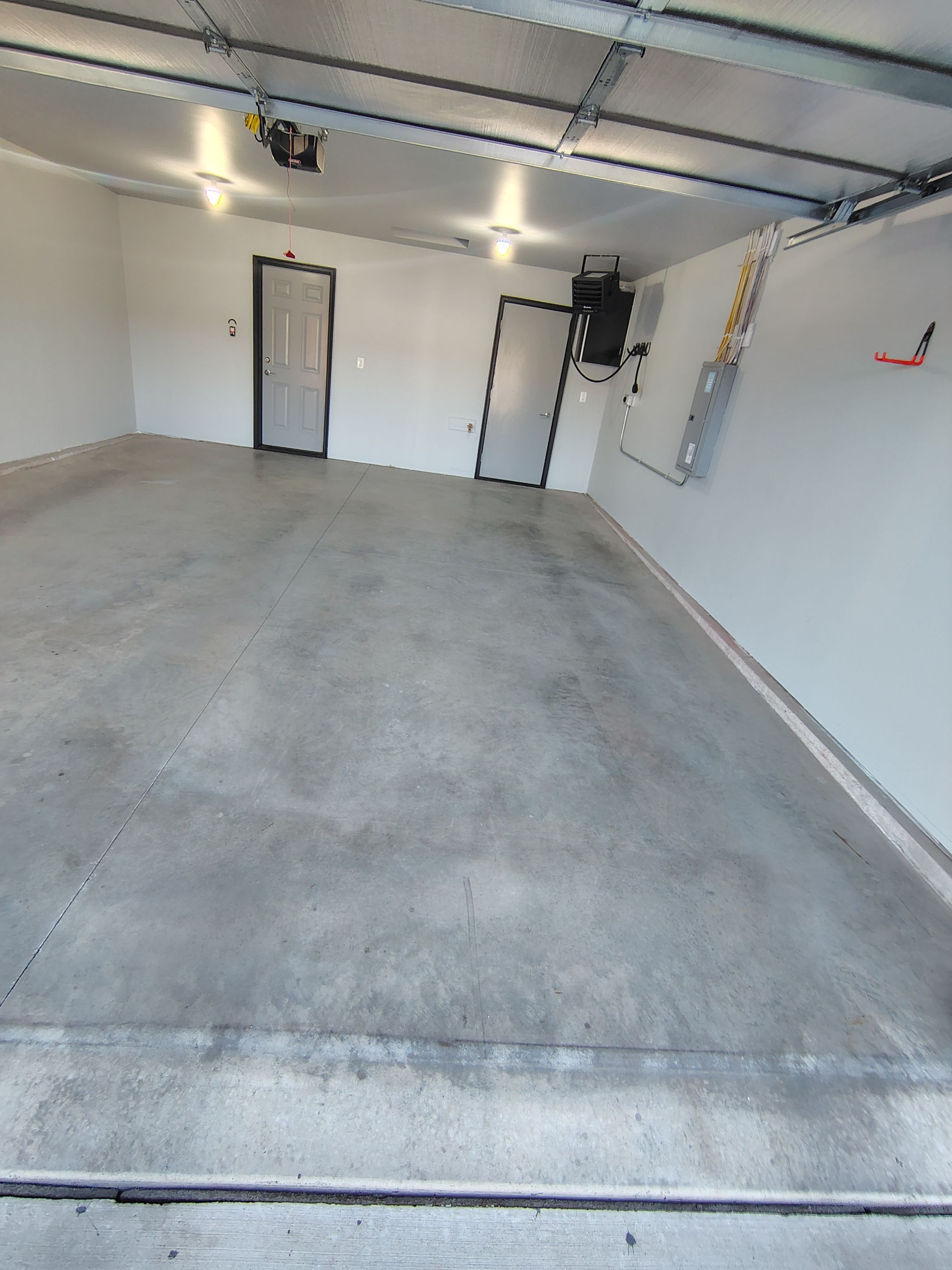 Custom Epoxy Garage Floor Coating Installation in Sioux Falls by Select Painting, Coatings & Garage Cabinets