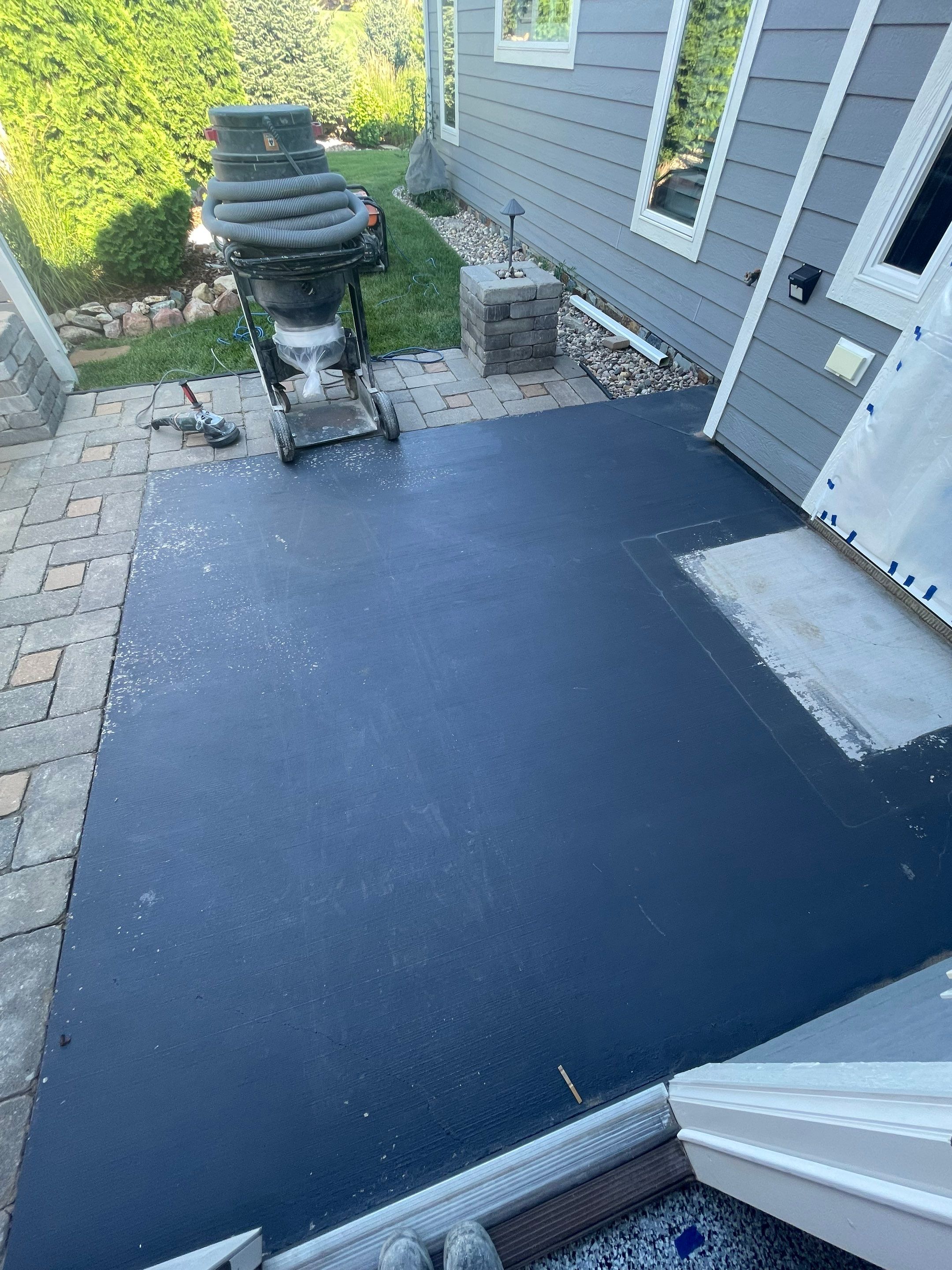 Concrete Patio Coating with Fuzzy Wool Finish in Sioux Falls by Select Painting, Coatings & Garage Cabinets