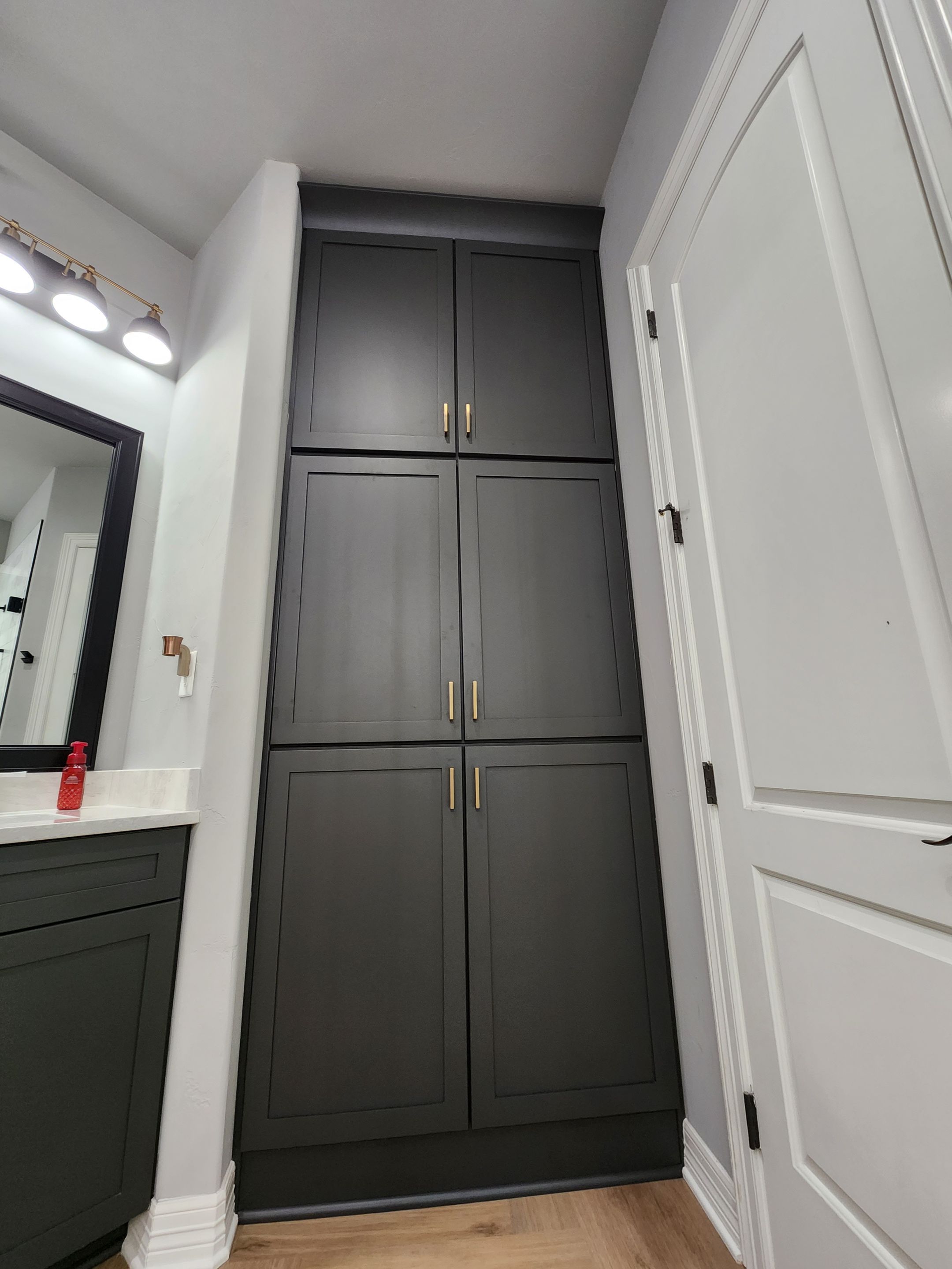 Spring Bathroom Remodel with Black Free-Standing Tub and Walk-In Shower by Legacy Bath and Kitchen
