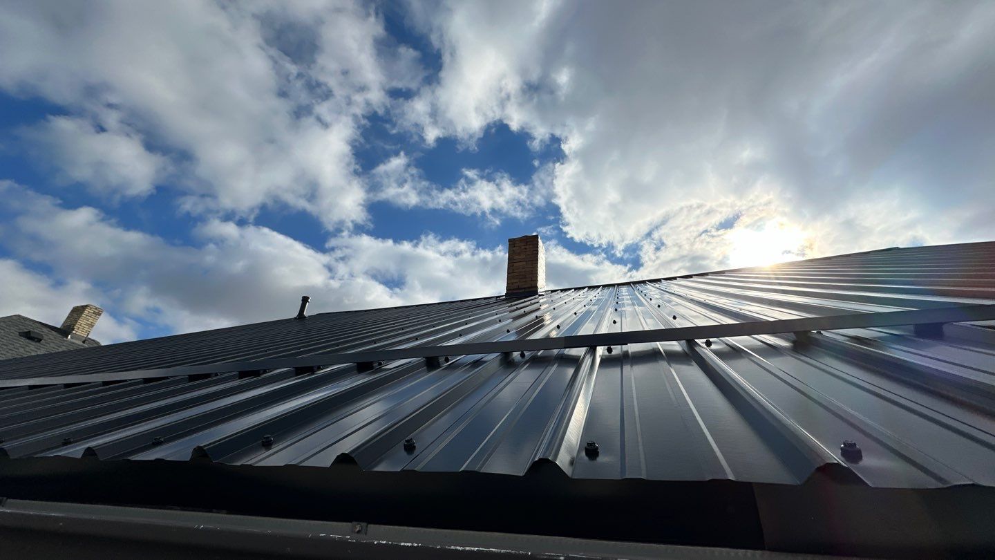 Residential Roofing Installation using Perfromance Panel Metal - Black by RoofX 