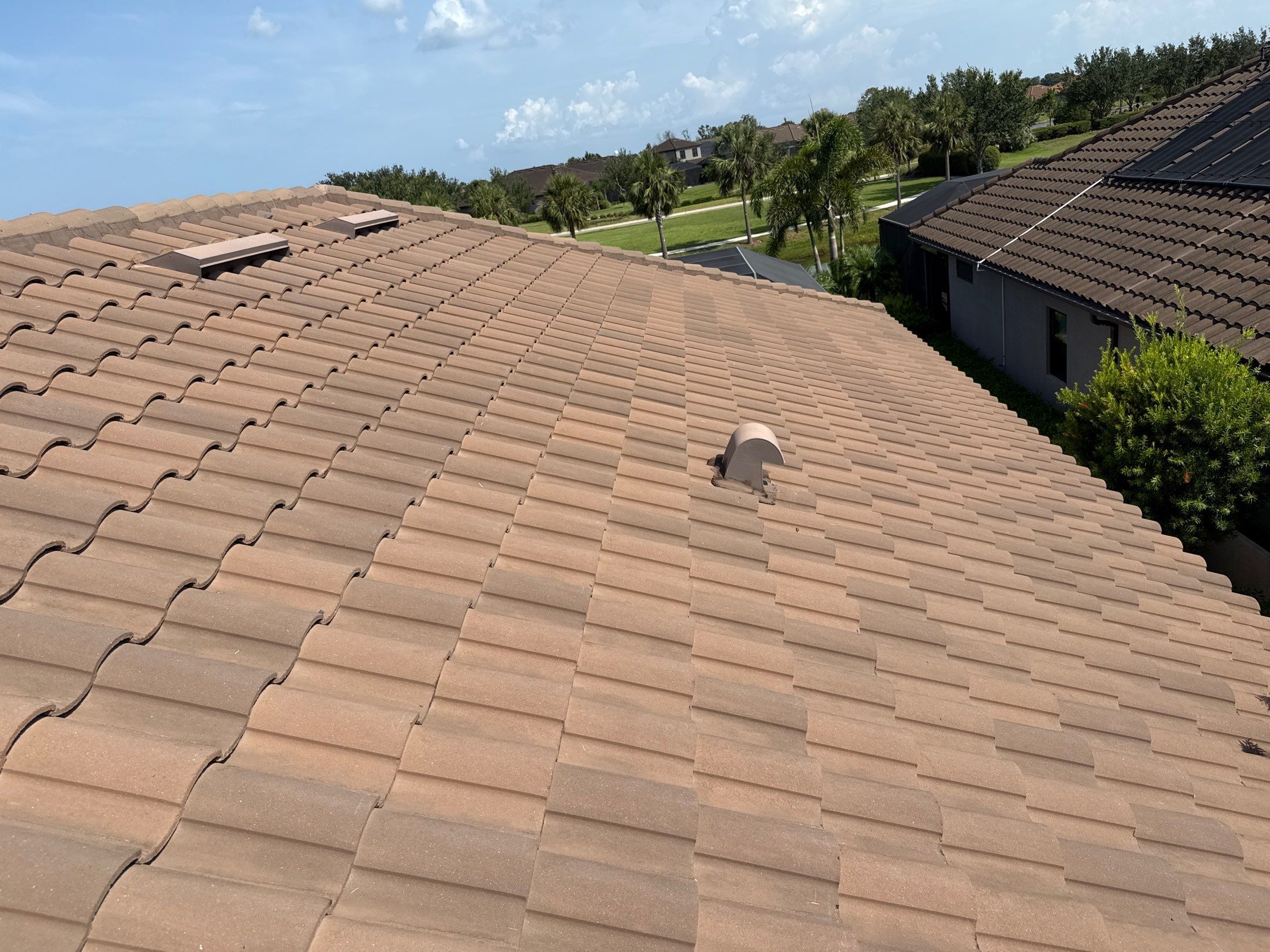 Soft Wash Roof Cleaning – Concrete Tile Roof | Artisan Lakes Esplanade, Palmetto, FL by Sunshine AquaWash