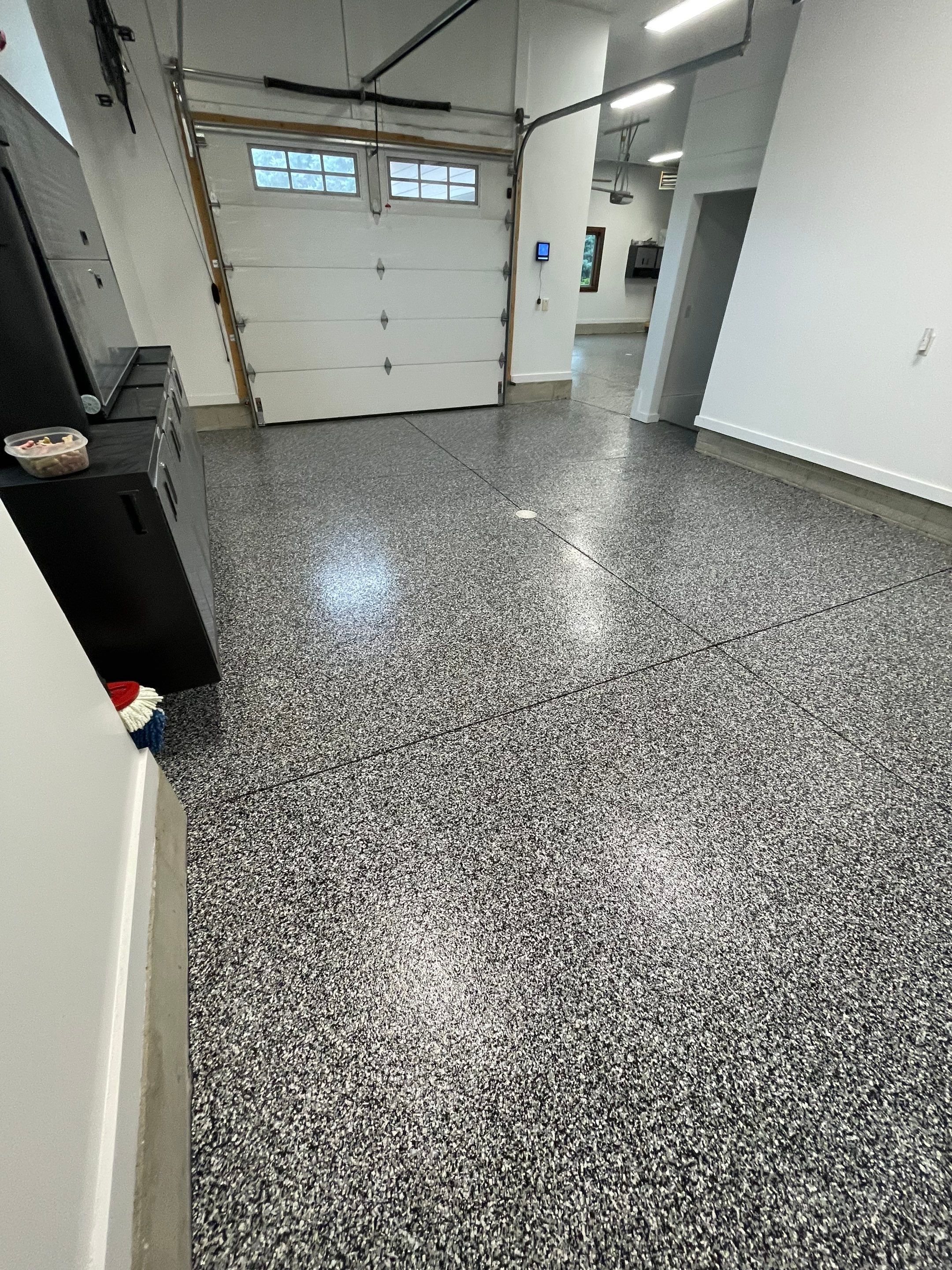 Garage Floor Coating and Domino Flake Finish in Sioux Falls by Select Painting, Coatings & Garage Cabinets