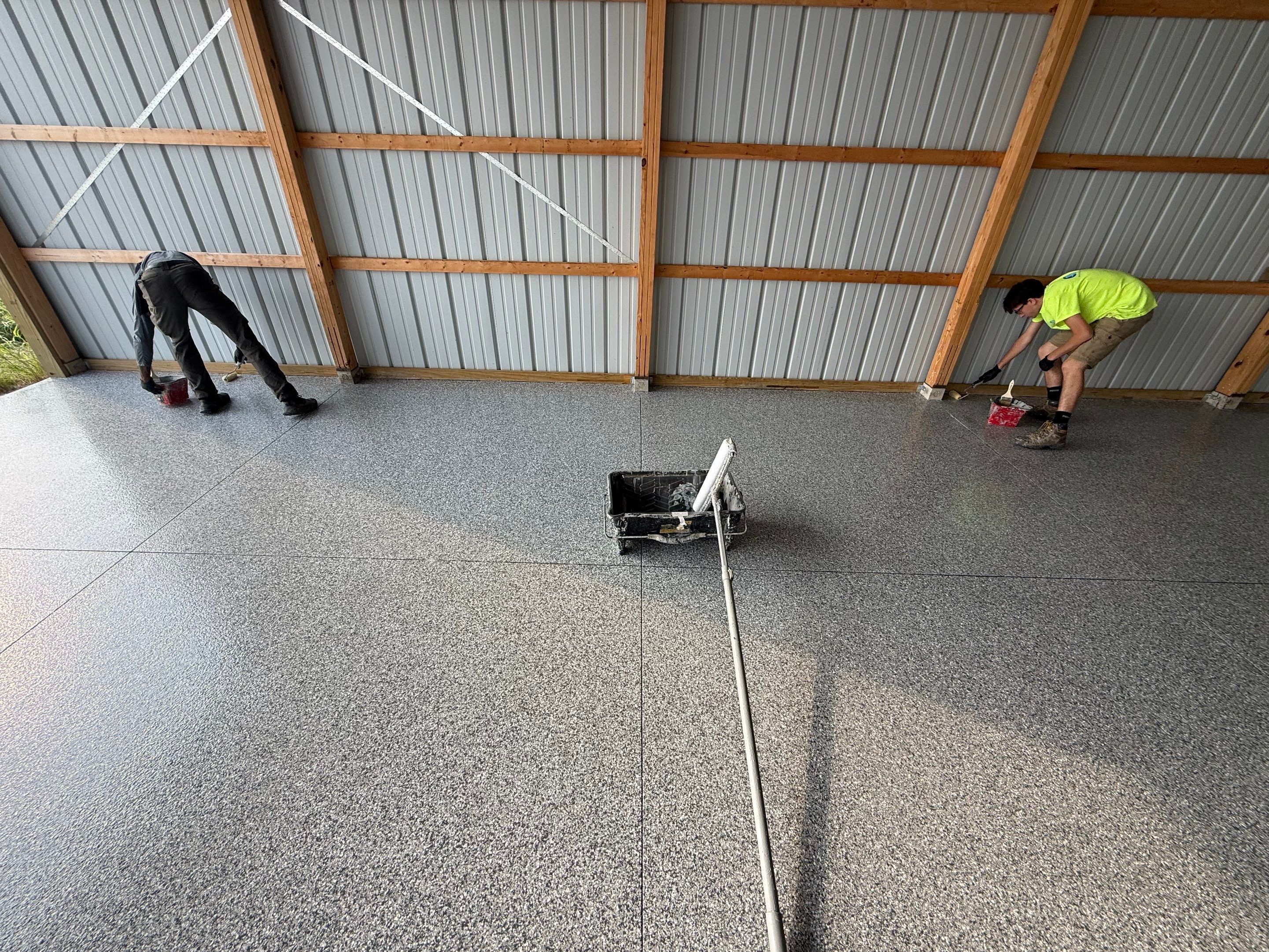 Durable Grey Speckled Epoxy Floor Coating for Yankton Shop by Select Painting, Coatings & Garage Cabinets