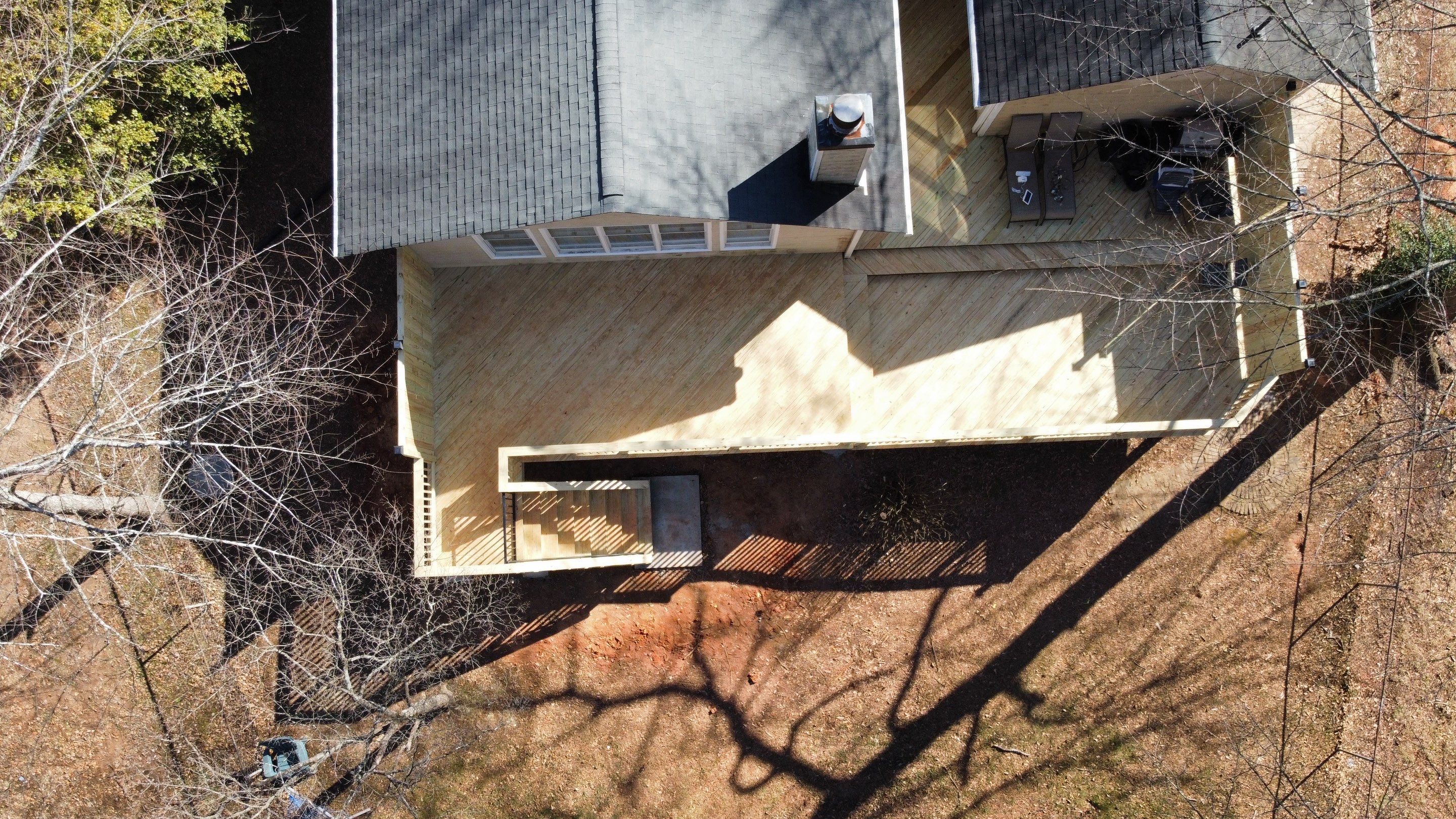 Elevated Pressure-Treated Wood Deck Extension in Marietta by Swift Home Renovations