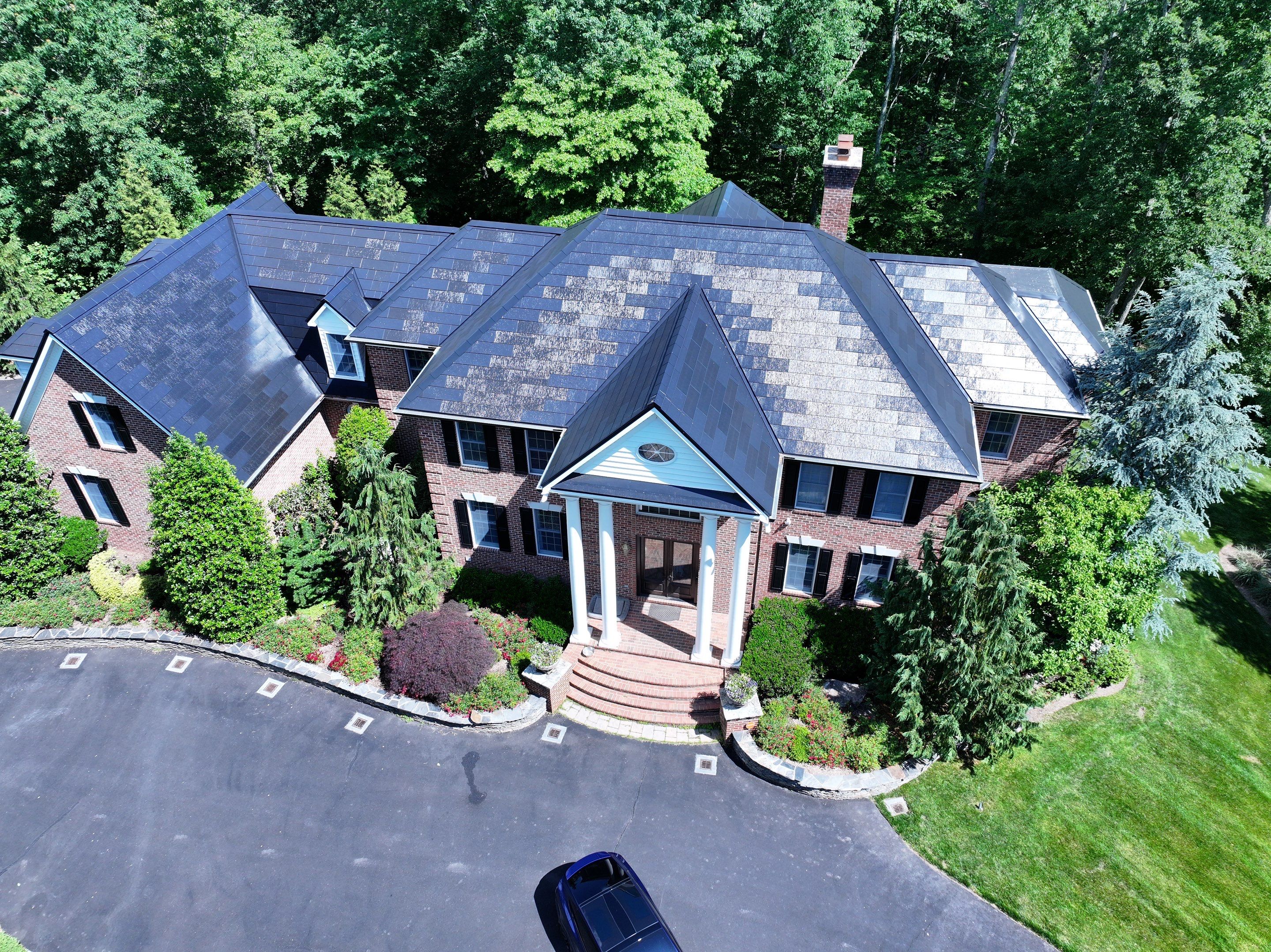 Tesla Solar Roof Replacement by American Home Contractors