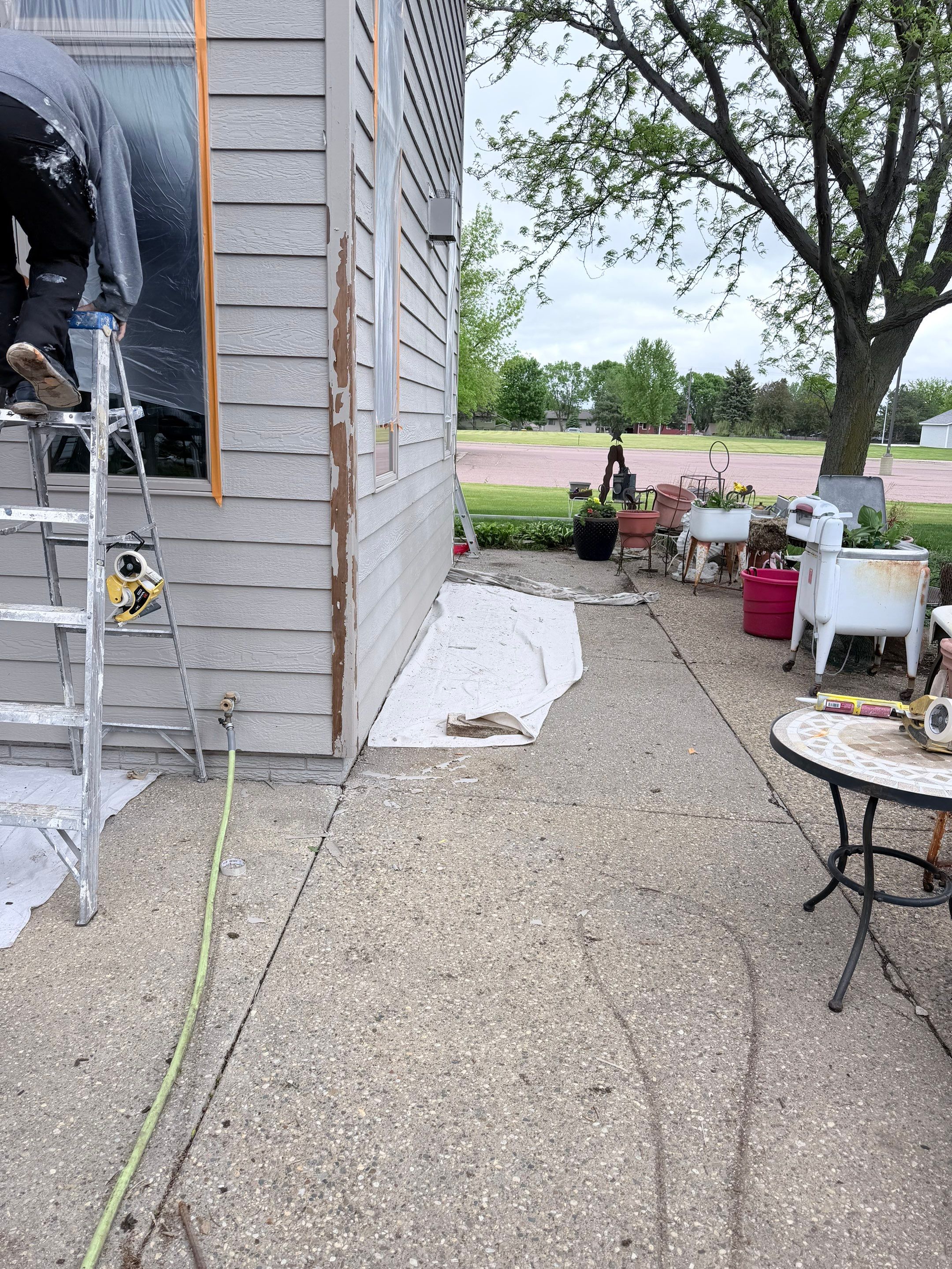 Exterior Siding and Trim Painting for Sioux Falls Residence by Select Painting, Coatings & Garage Cabinets