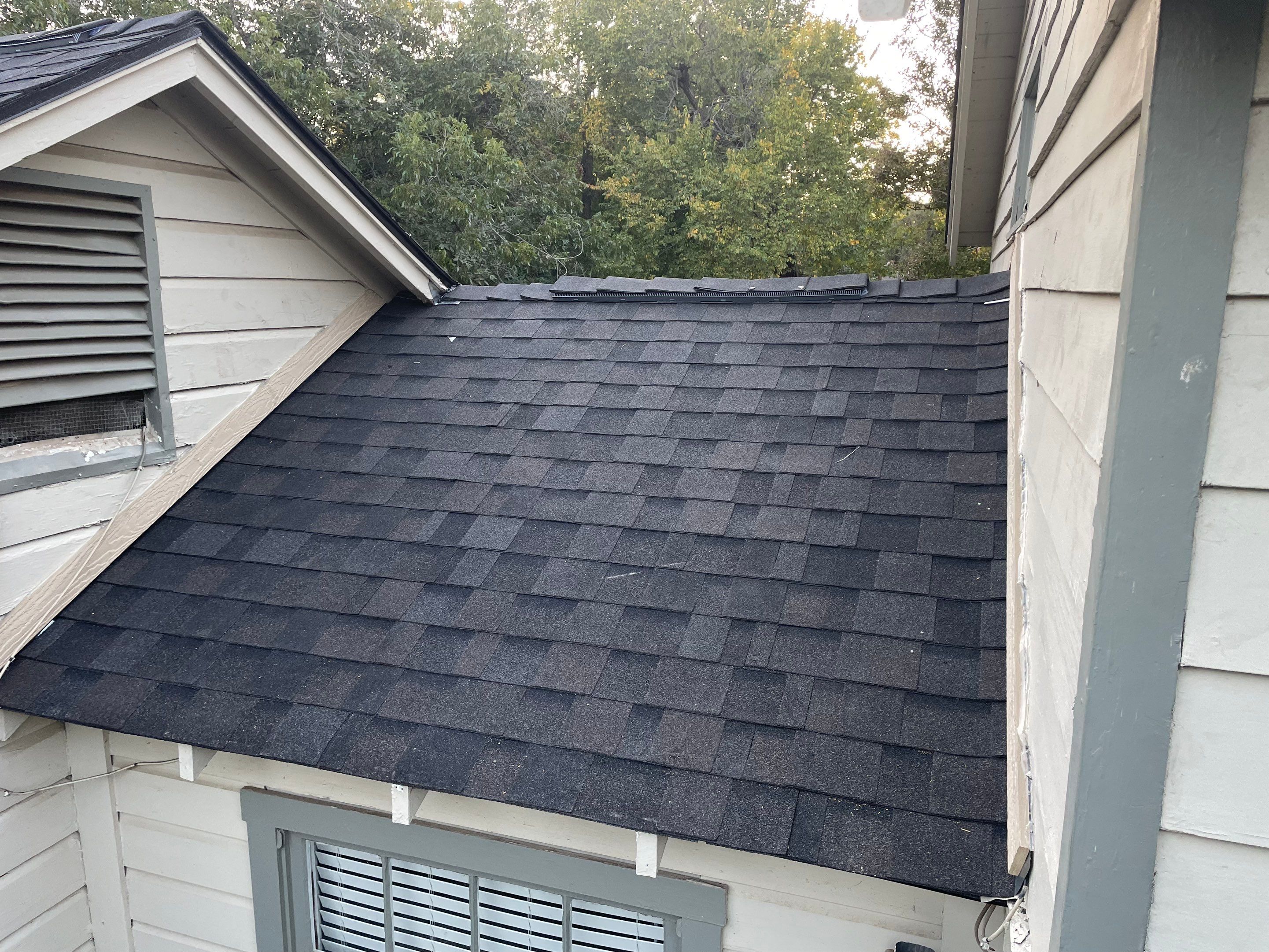 White exterior with IKO Glacier by Tejas Roofworks + Restoration