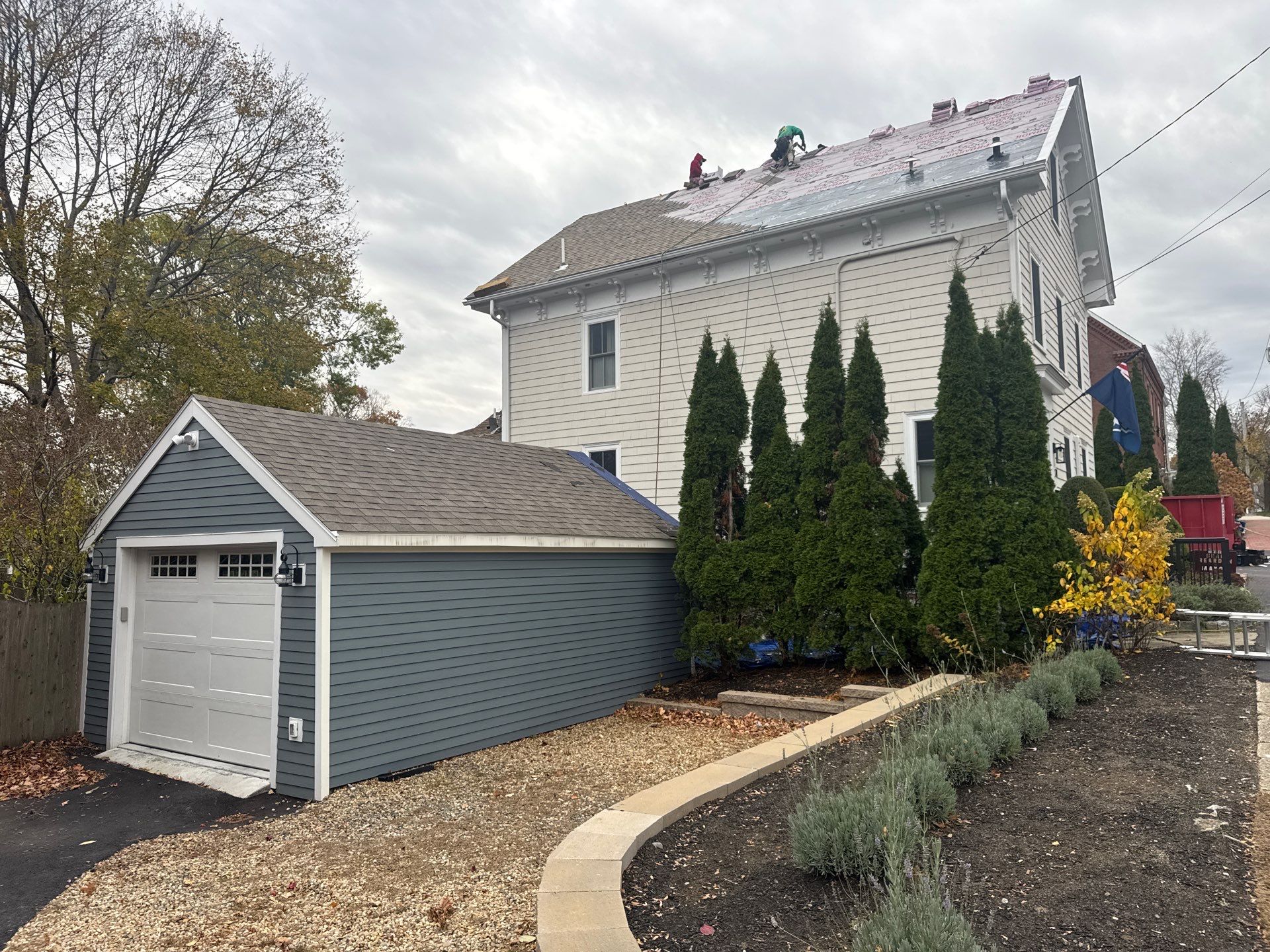 Newburyport Complete Roof Replacement with Solar Venting Skylight by Mighty Dog Roofing of Greater Middlesex County