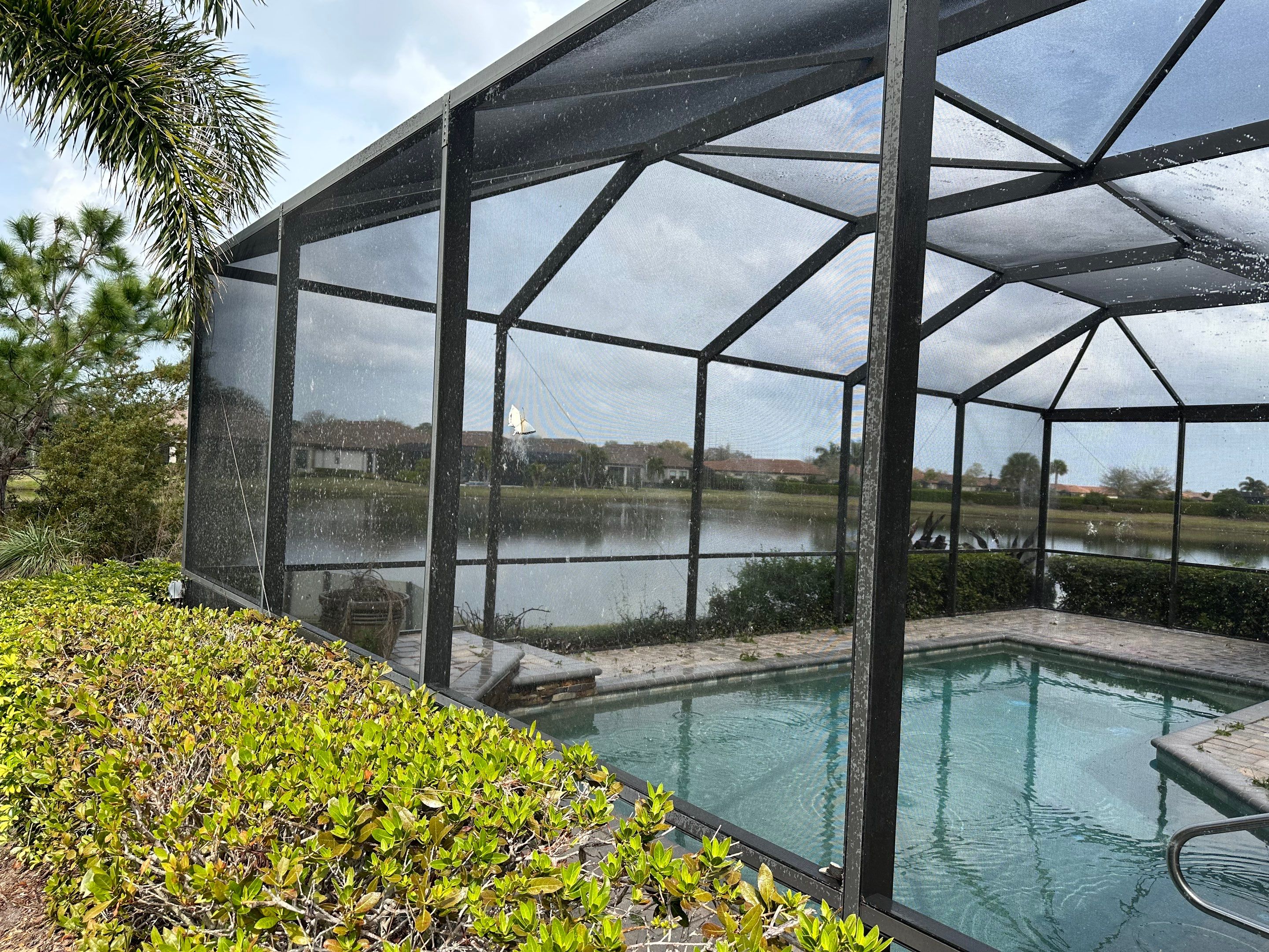 Concrete Tile Roof, Paver Pool Deck, Screen Enclosure & Driveway Cleaning in Artisan Lakes Esplanade, Palmetto, FL | Sunshine AquaWash by Sunshine AquaWash