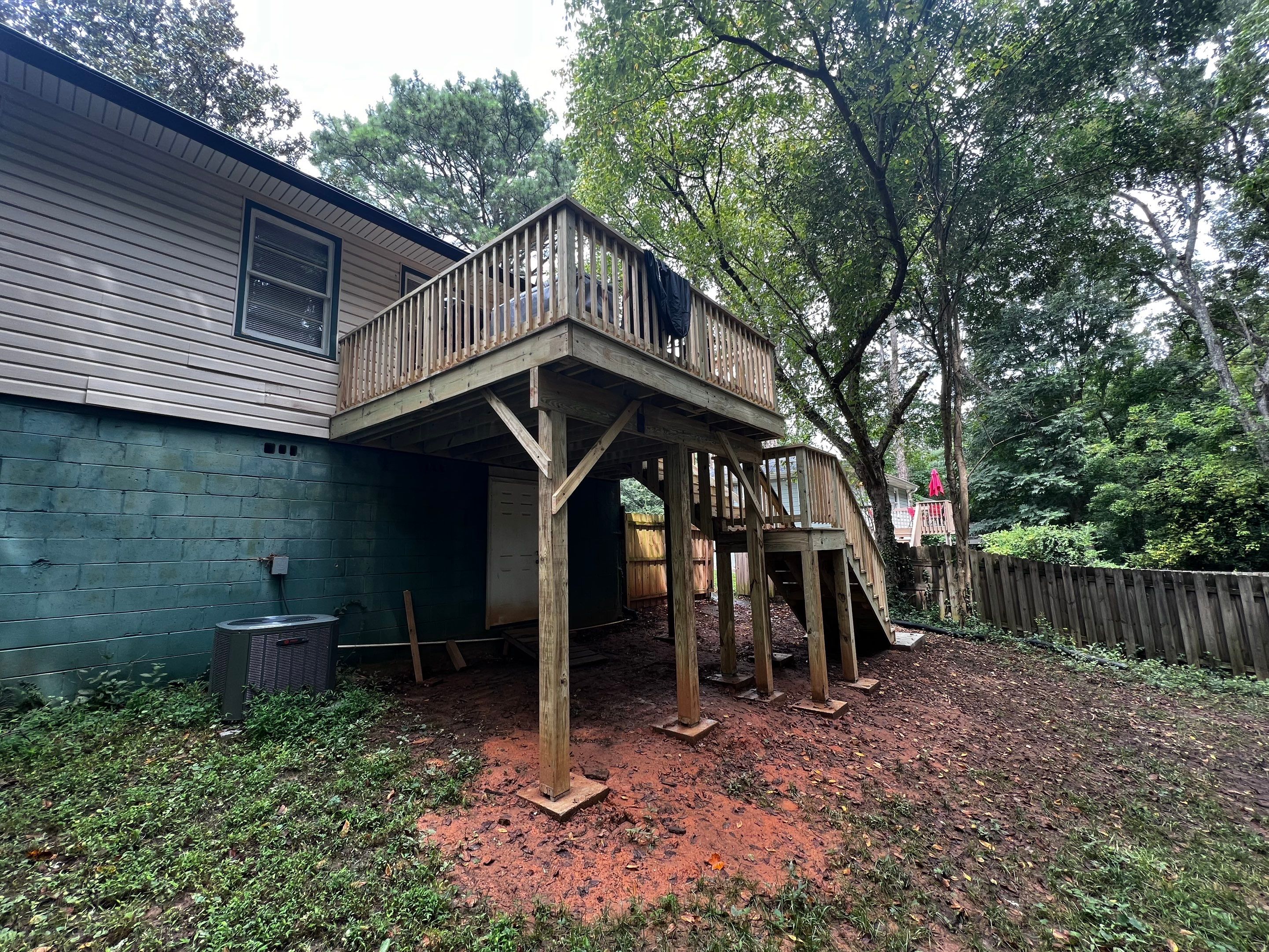 Elevated Pressure-Treated Wood Deck and Staircase Replacement in Atlanta by Swift Home Renovations