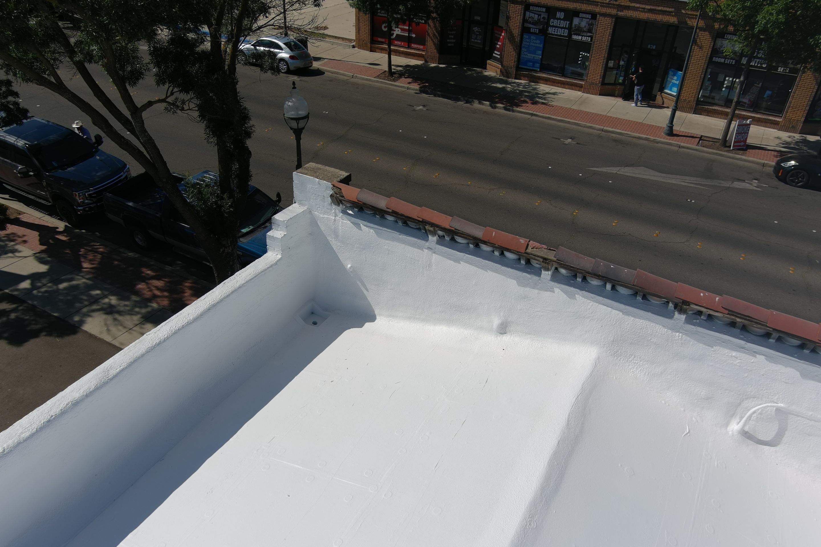 Commercial Roofing Installation using Conklin BenchPly system with PUMA top coat (imbedded fabric system) by Straight Edge Roofing Inc
