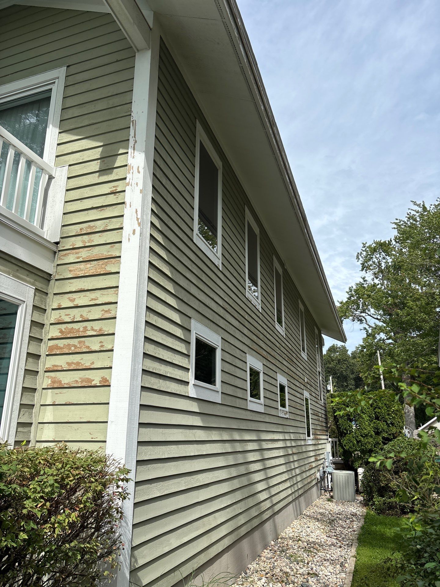 Full Exterior Painting and Trim Restoration for Muskegon Residence by Gordon Painting