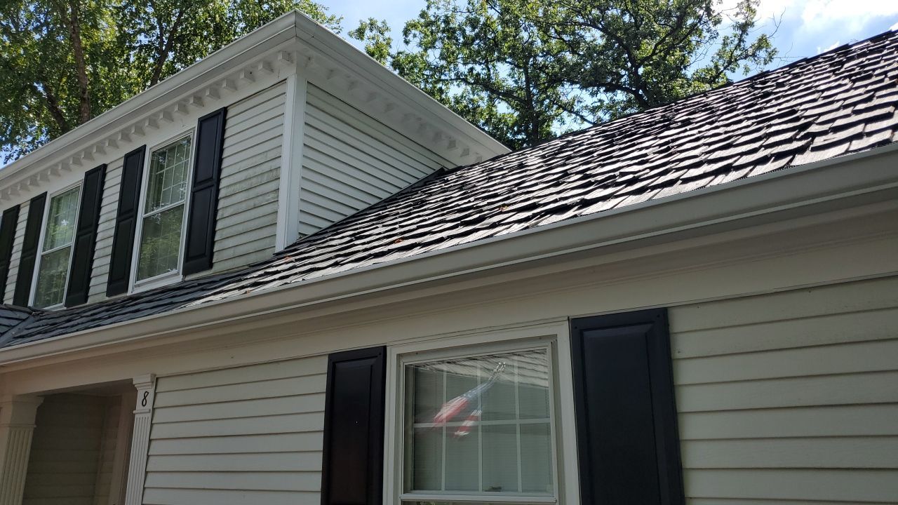 Housewashing  using Algaecide, soft wash soap by Northern Power Washing LLC.
