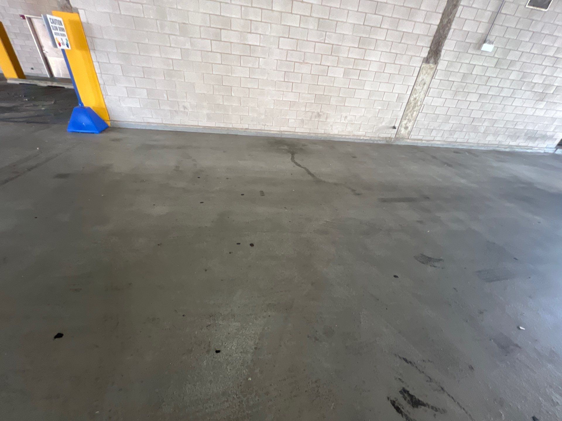 Parking garage using Hot water by Northern Power Washing LLC.