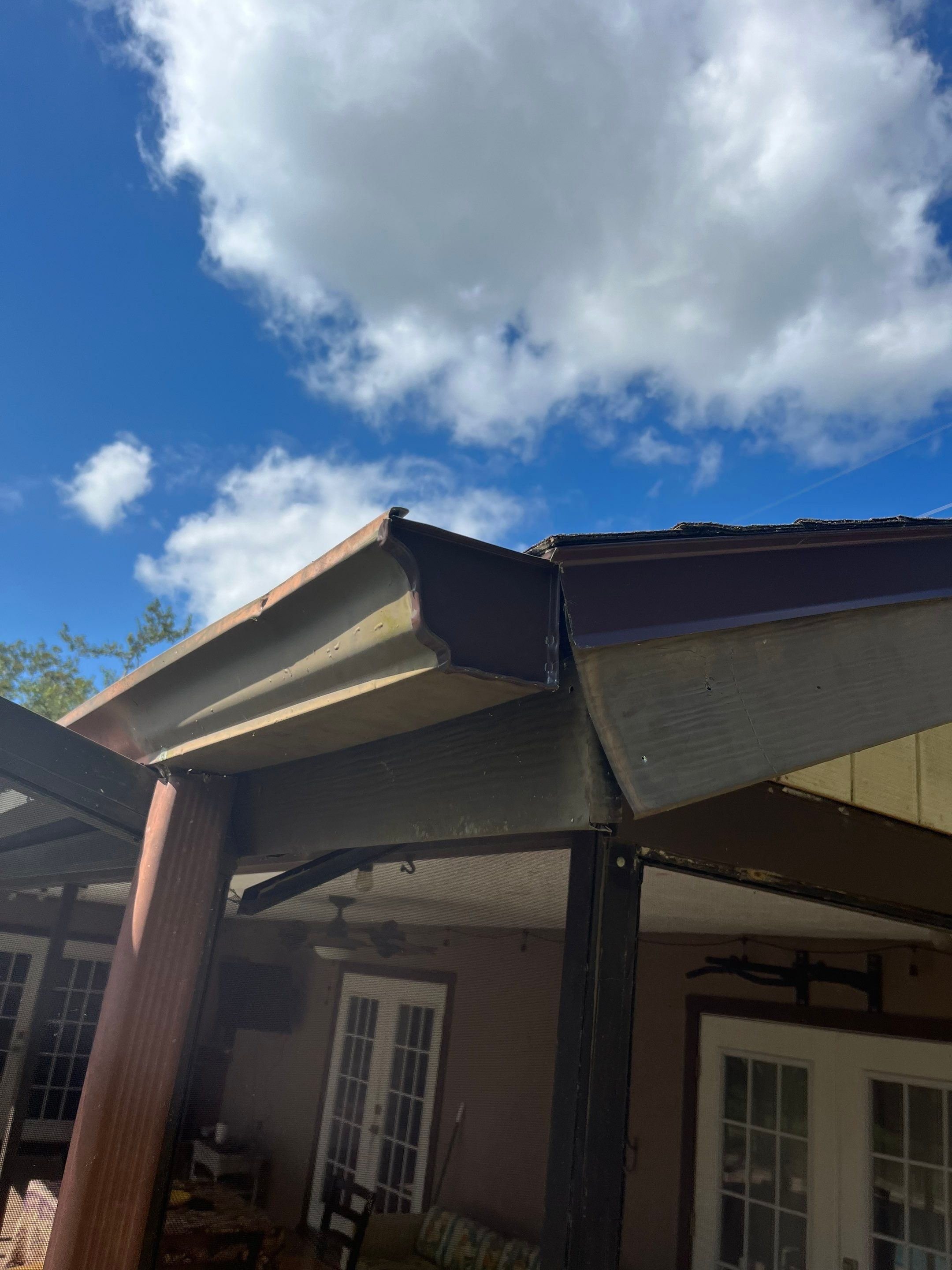 Brown Seamless Gutters for Beach Cottages in Sarasota FL by Gutter Professors