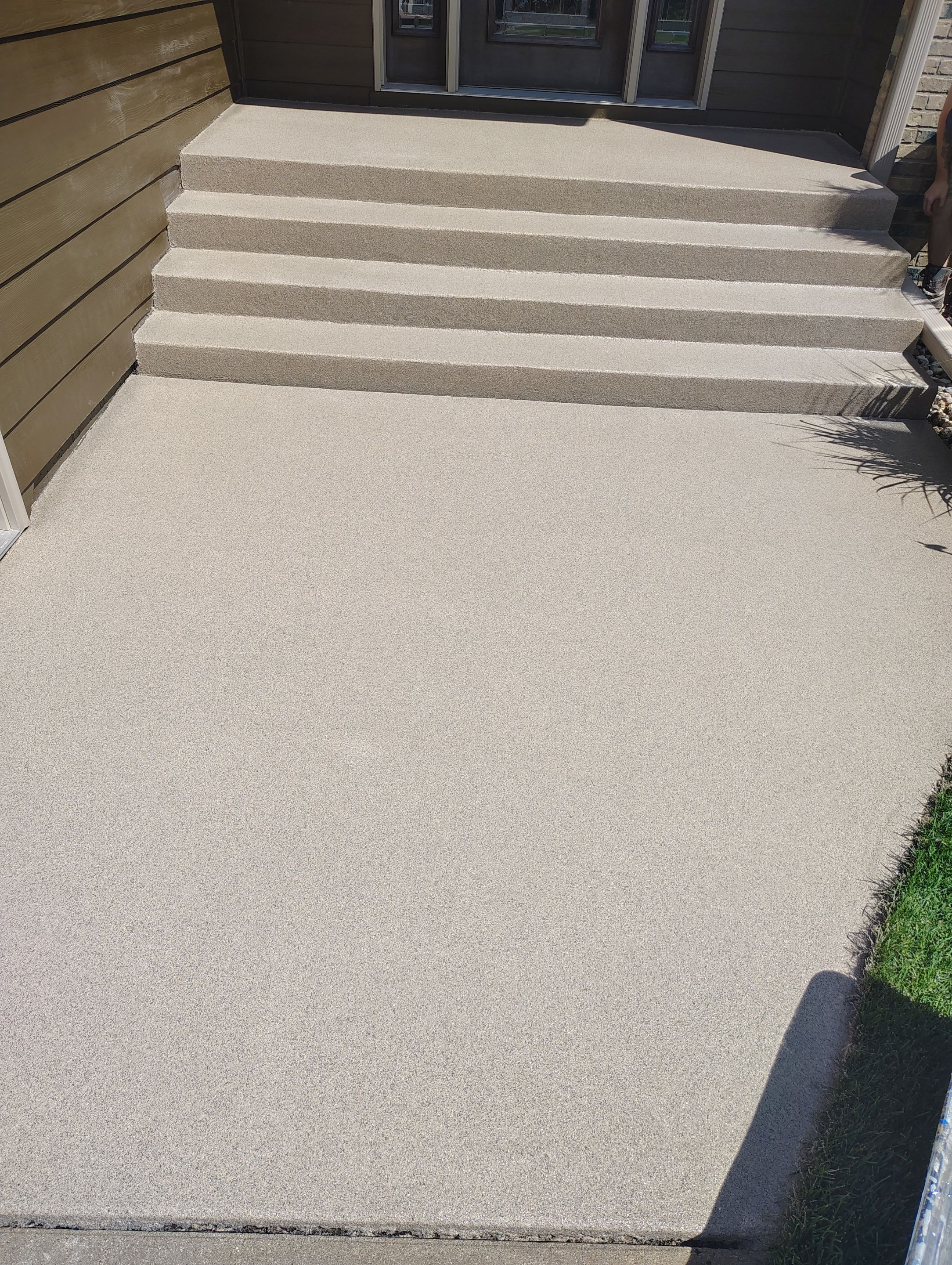 Textured Concrete Coating and Entryway Restoration in Madison by Select Painting, Coatings & Garage Cabinets