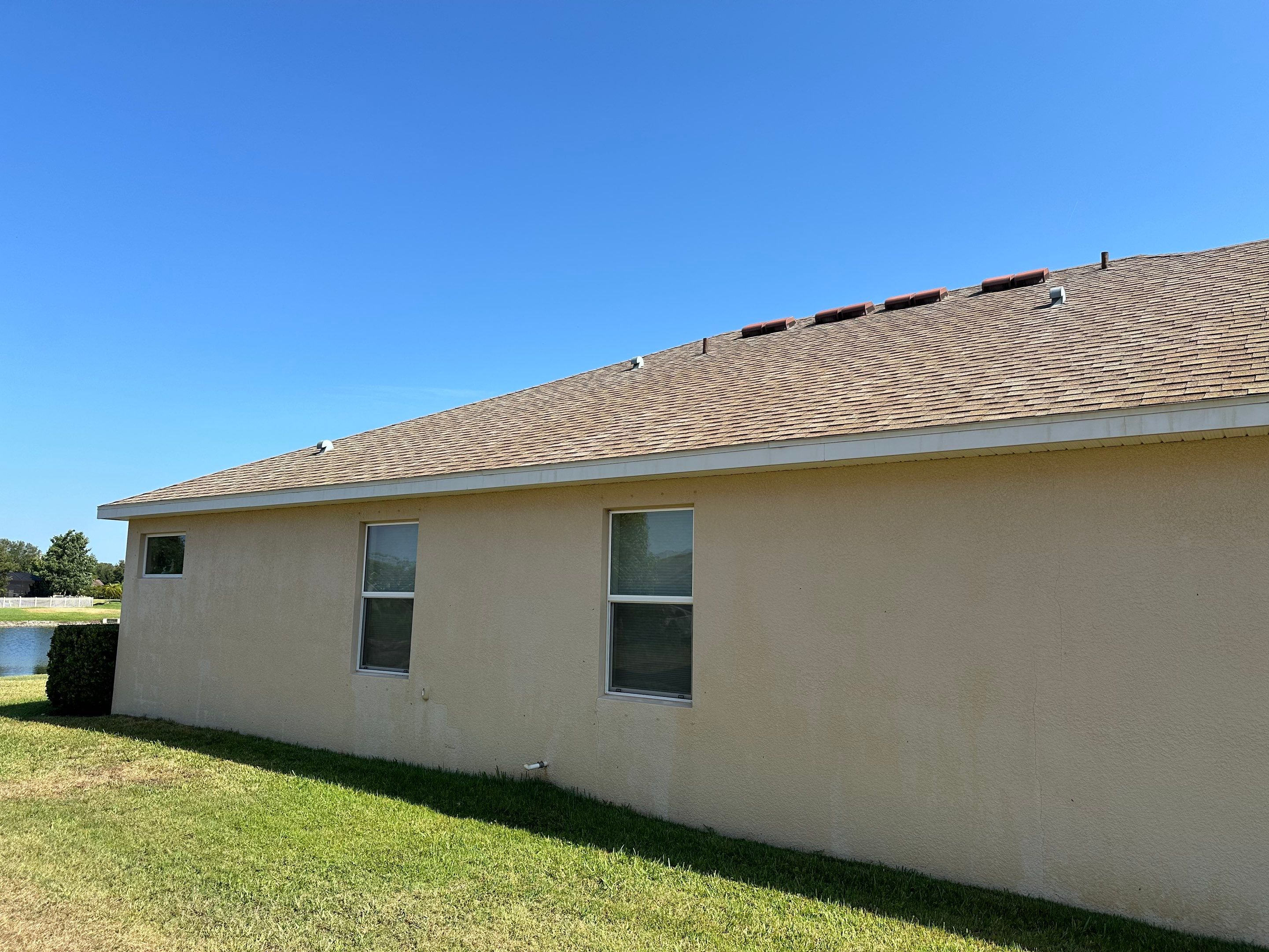 Asphalt Shingle Roof Soft Wash Cleaning & Concrete Pressure Washing in CopperStone Community, Parrish, FL by Sunshine AquaWash