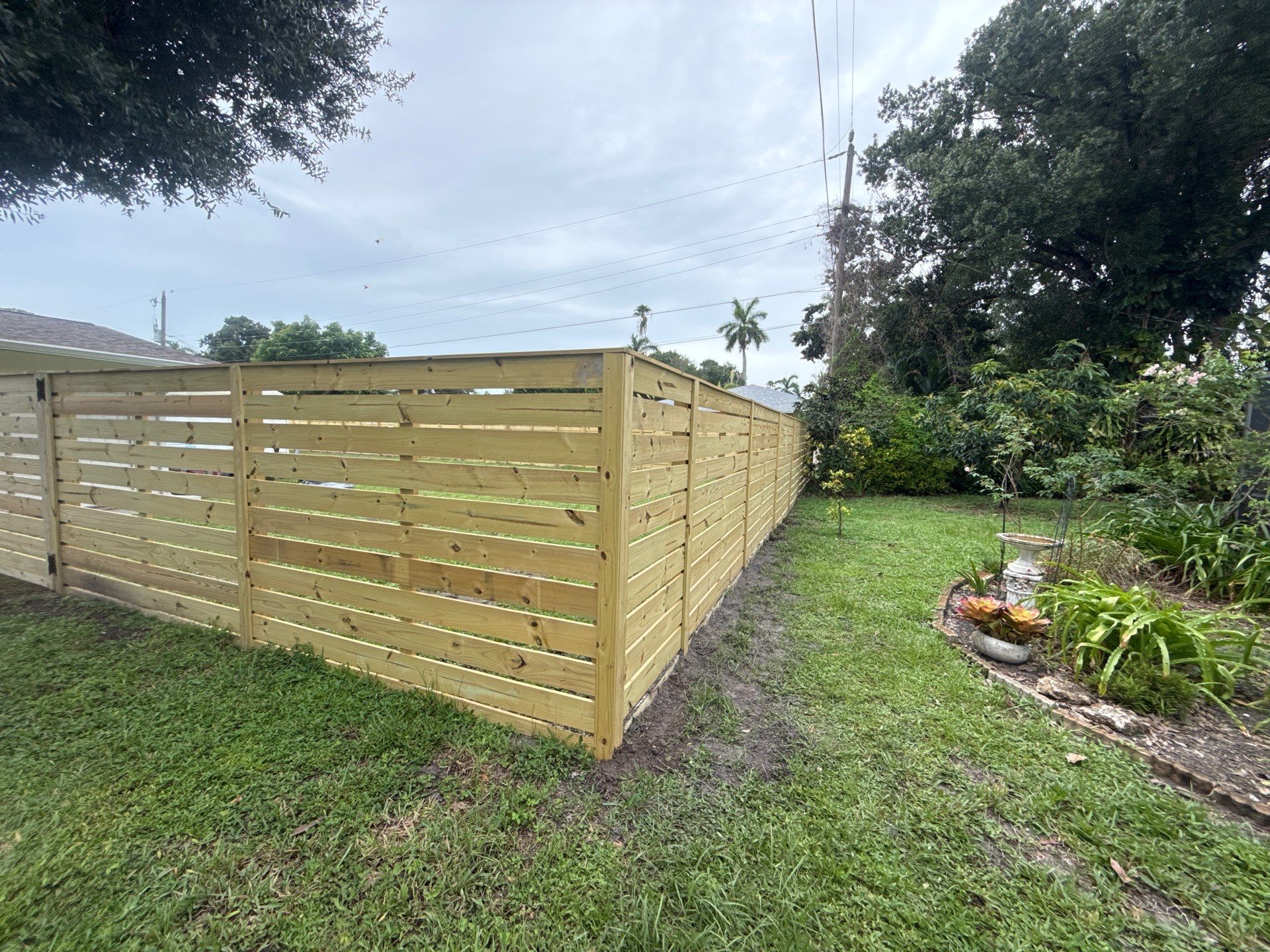 Modern Horizontal Wood Privacy Fence Installation in Fort Myers by True Fence LLC