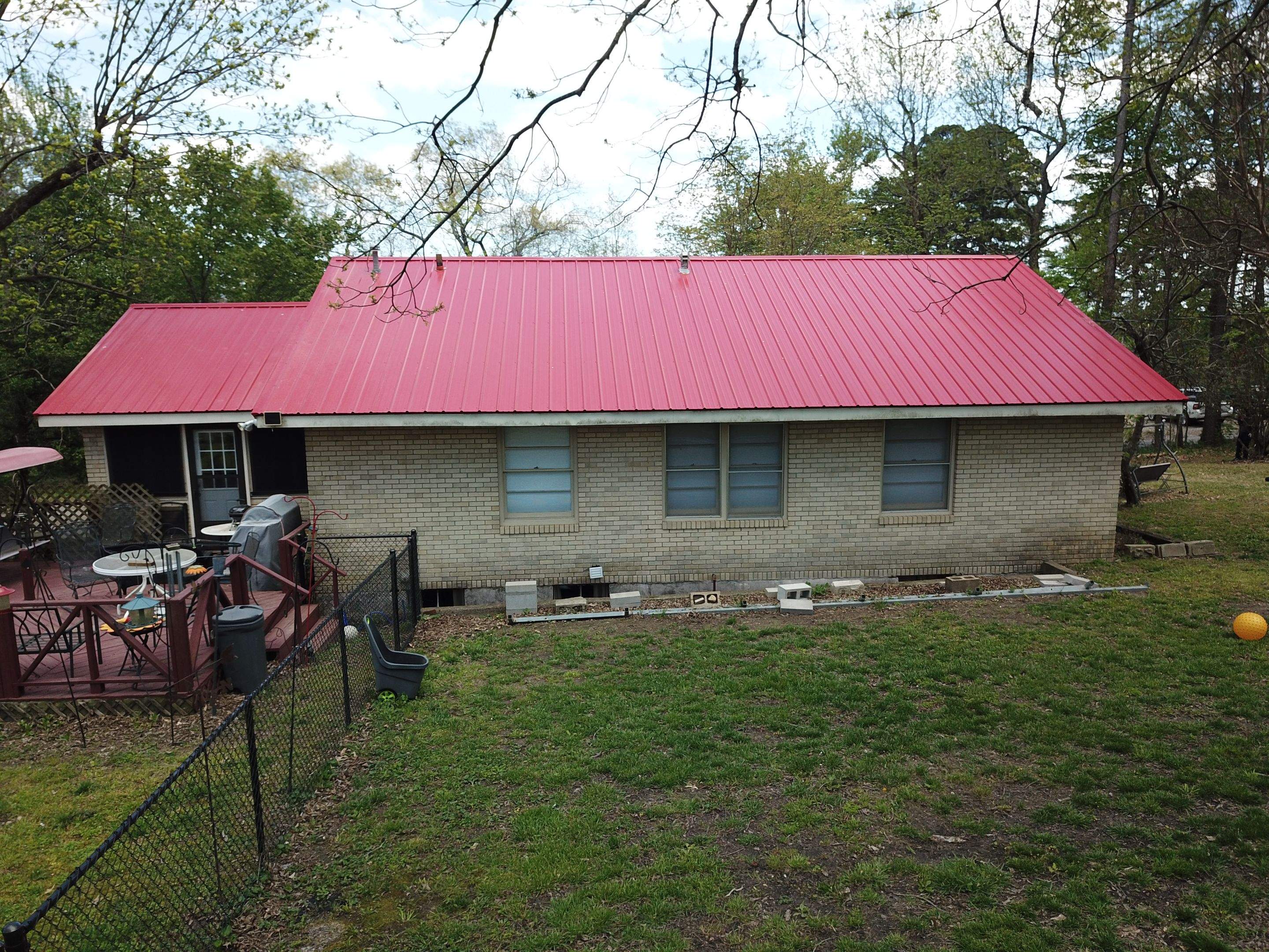 Residential Roofing Installation using 26 Gauge Colored Panels by Hostetler Roofing