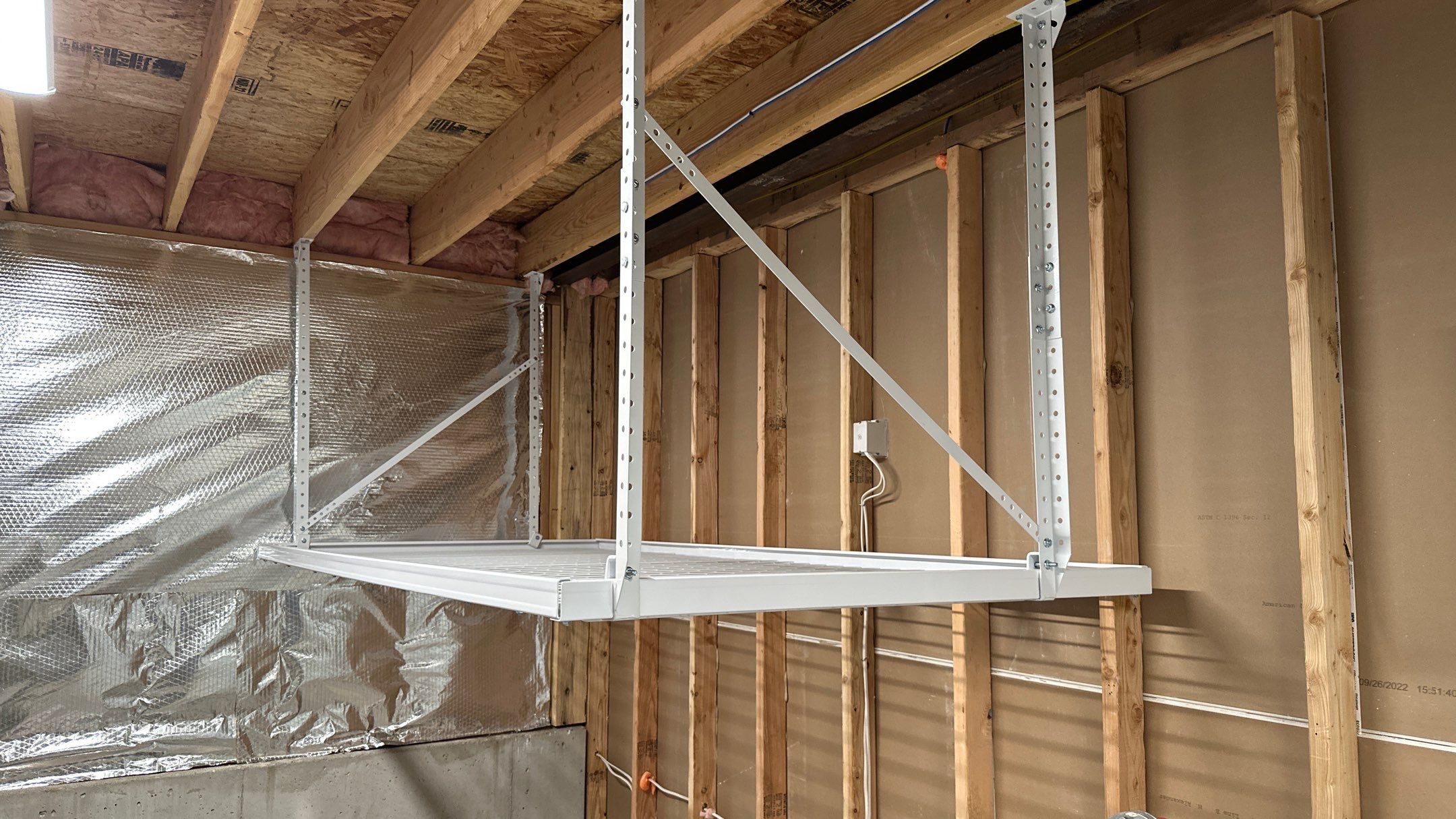 Brandon C. added these overhead racks to upgrade his storage  by Banner Garage