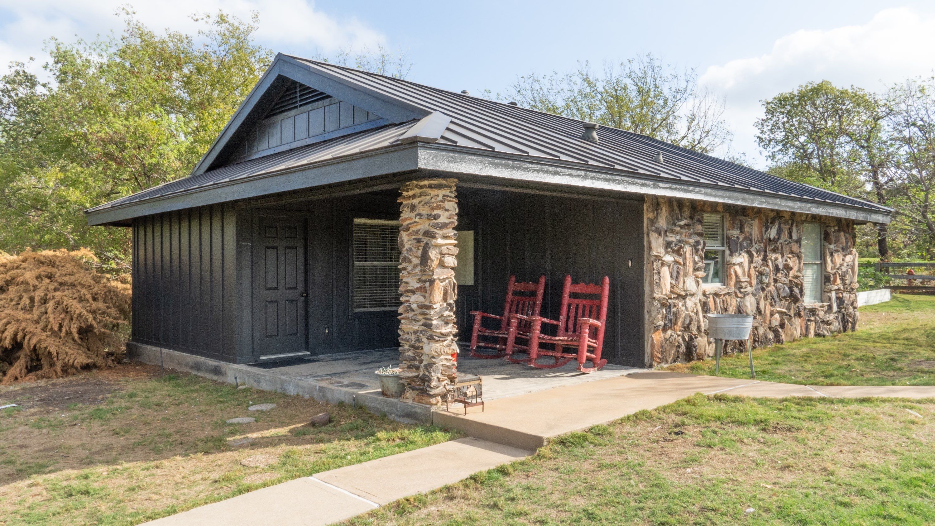 Dark Bronze Standing Seam Metal Roof by First Out Roofing 