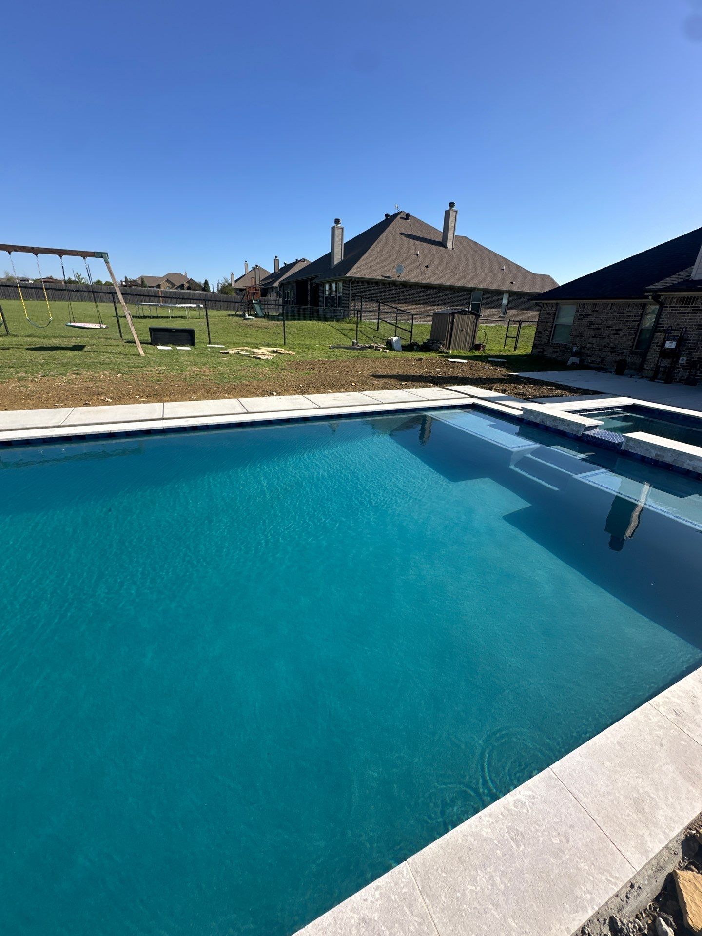 Geometric Pool with Raised Spa and Tanning Ledge by Pinnacle Pools and Spas - DFW