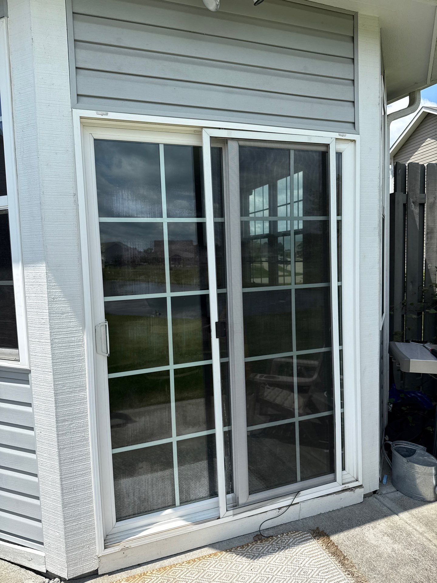 White Vinyl Sliding Patio Door Replacement in McCordsville by Merrifield Exteriors, LLC