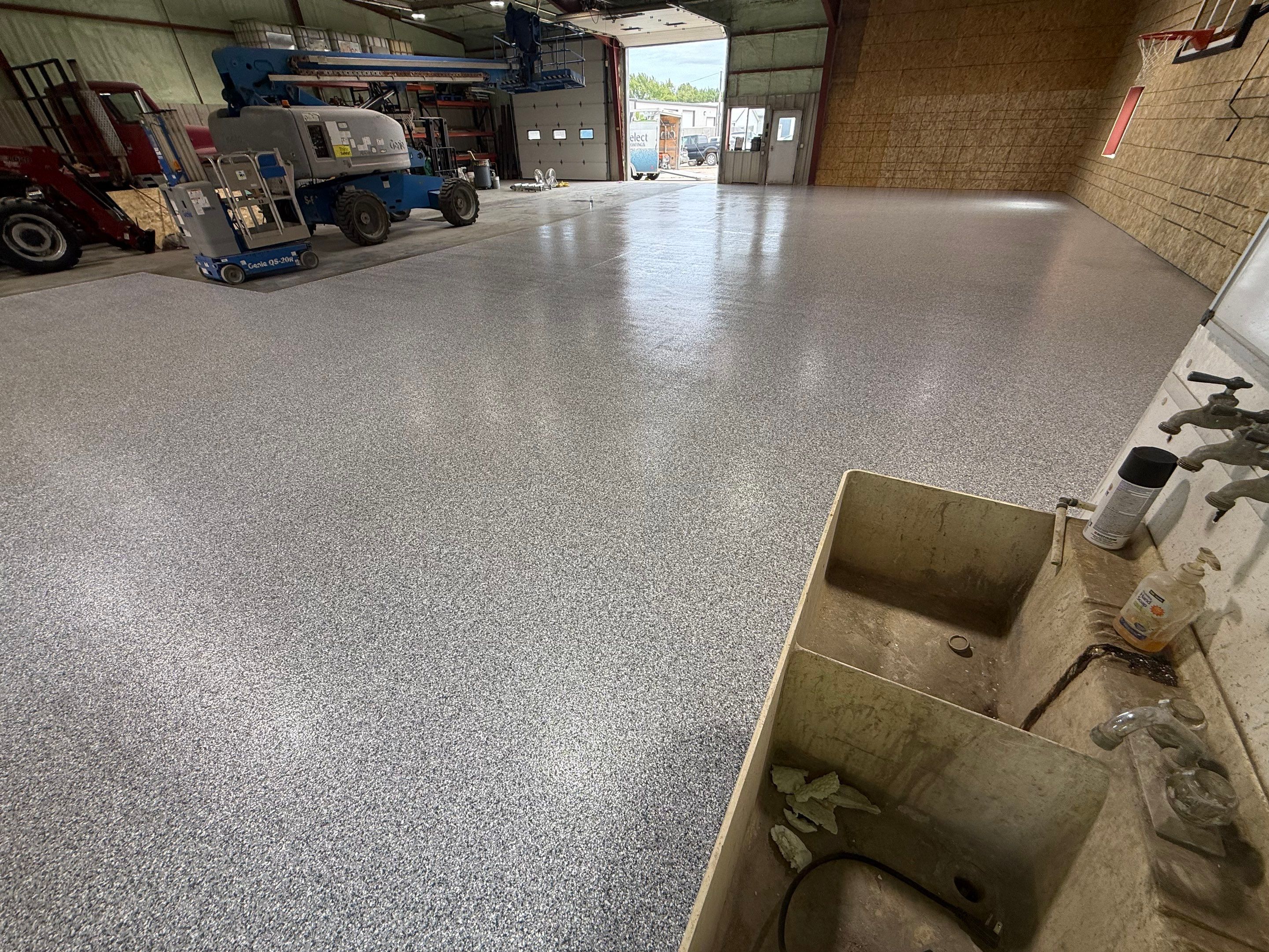 Custom Polyurea Shop Floor with Basketball Court Lines in Rock Valley by Select Painting, Coatings & Garage Cabinets